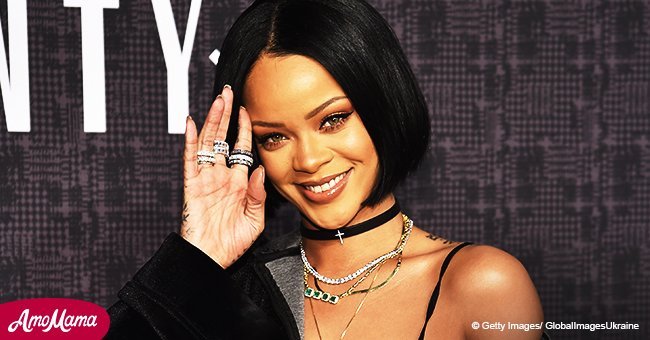 Rihanna goes braless in a completely see-through outfit and thigh-high boots