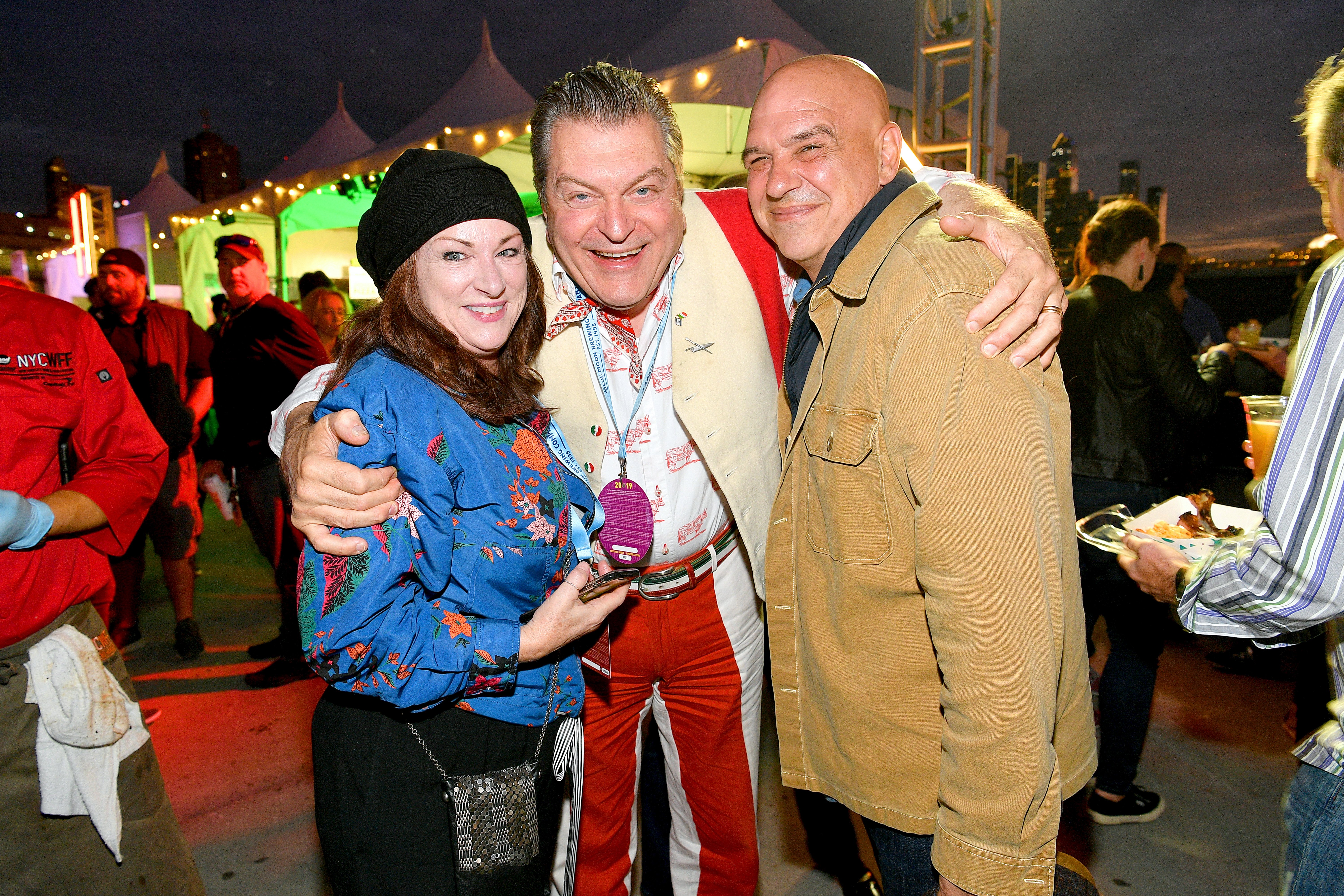 Liz Shanahan, Dario Cecchini and Michael Symon during Titans of BBQ at Pier 97 on October 12, 2019 in New York City. / Source: Getty Images