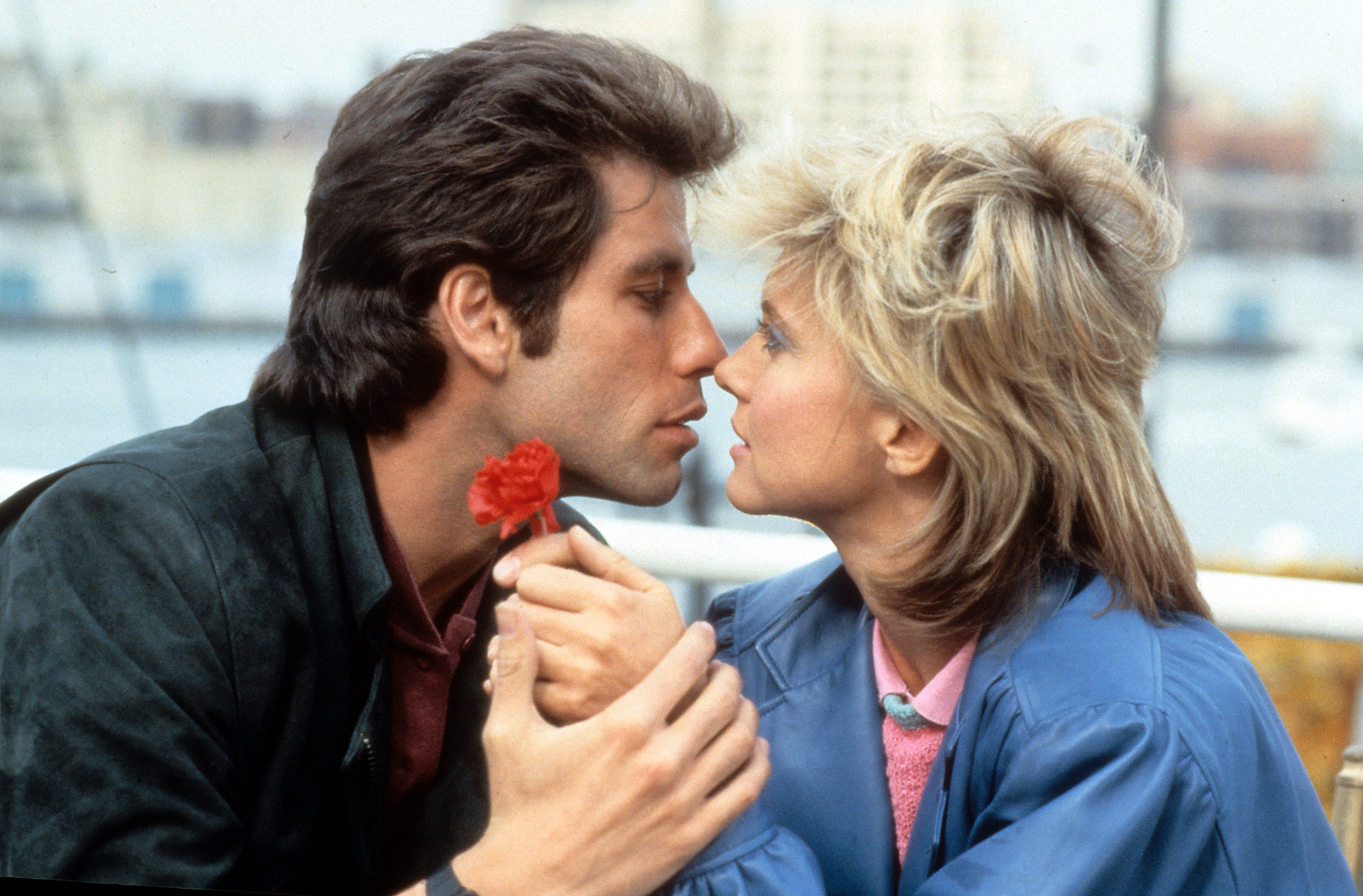 John Travolta kissing Olivia Newton-John in a scene from the 1983 film "Two Of A Kind." / Source: Getty Images