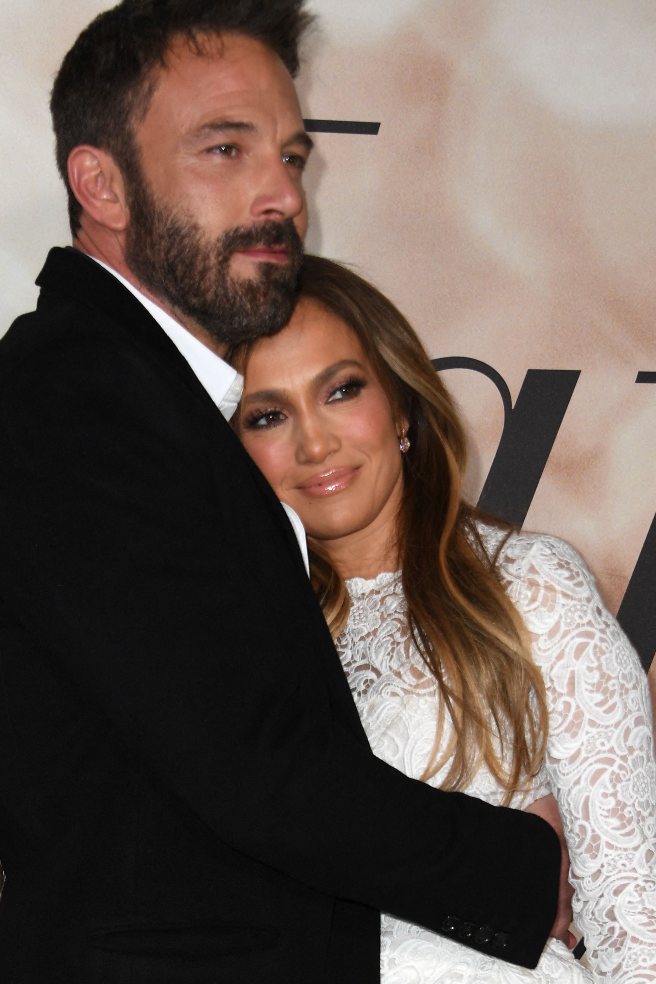 Ben Affleck appears serious while posing with Jennifer Lopez at the