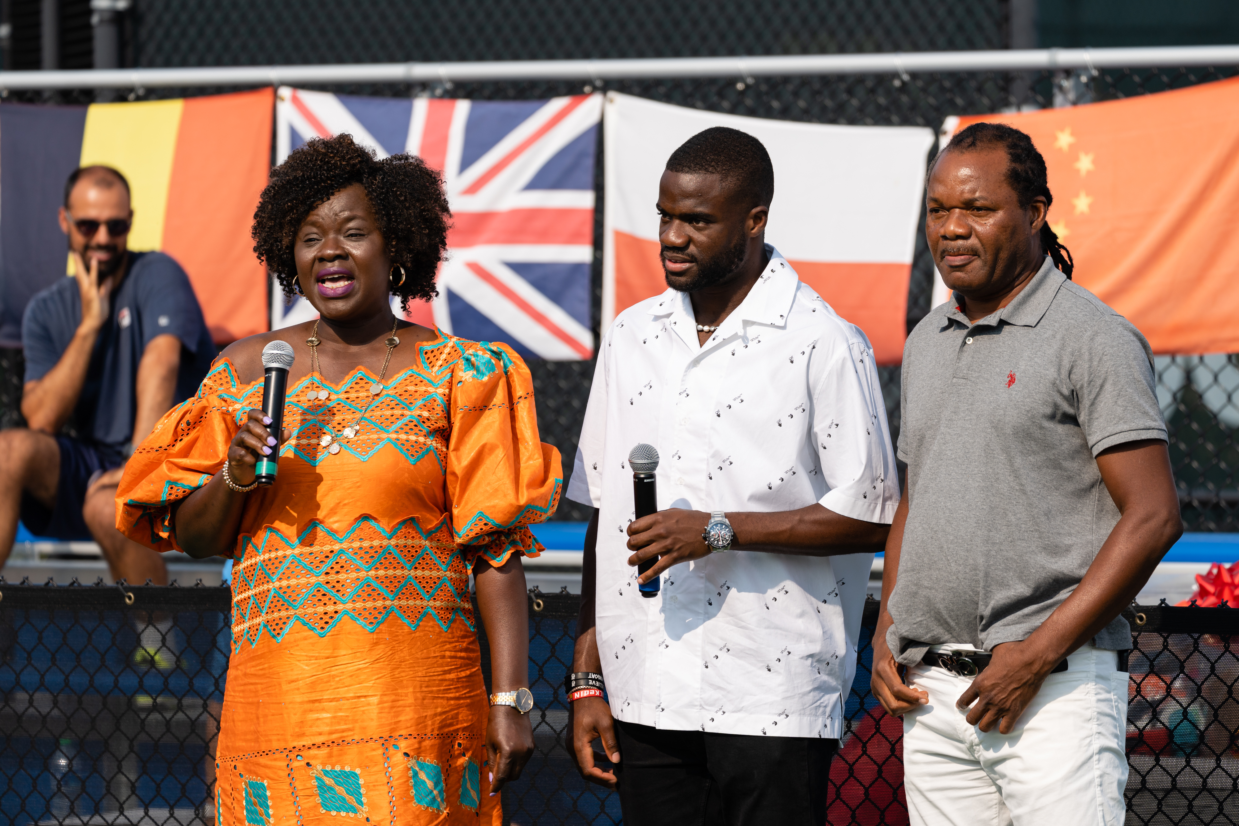 (L-R) Alphina Tiafoe, Frances Tiafoe, and Constant Tiafoe during an event celebrating Frances's return to Prince Georges County at Junior Tennis Champions Center on September 16, 2022,  in College Park, Maryland. | Source: Getty Images