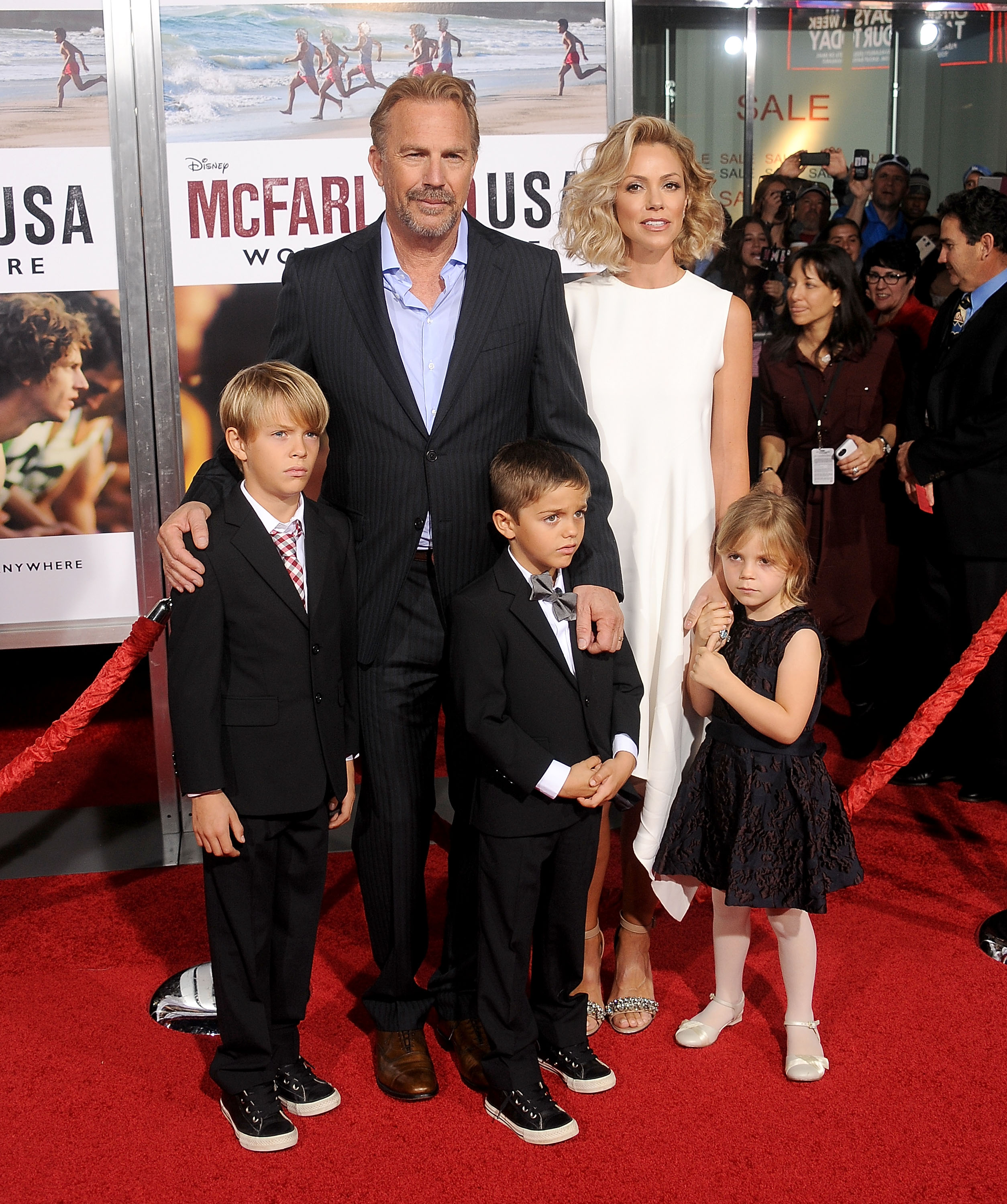 Kevin Costner, Christine Baumgartner, Cayden Wyatt Costner, Hayes Logan Costner, and Grace Avery Costner pose as they arrive at the World Premiere of Disney's "McFarland, USA" at the El Capitan Theatre on February 9, 2015, in Hollywood, California | Source: Getty Images