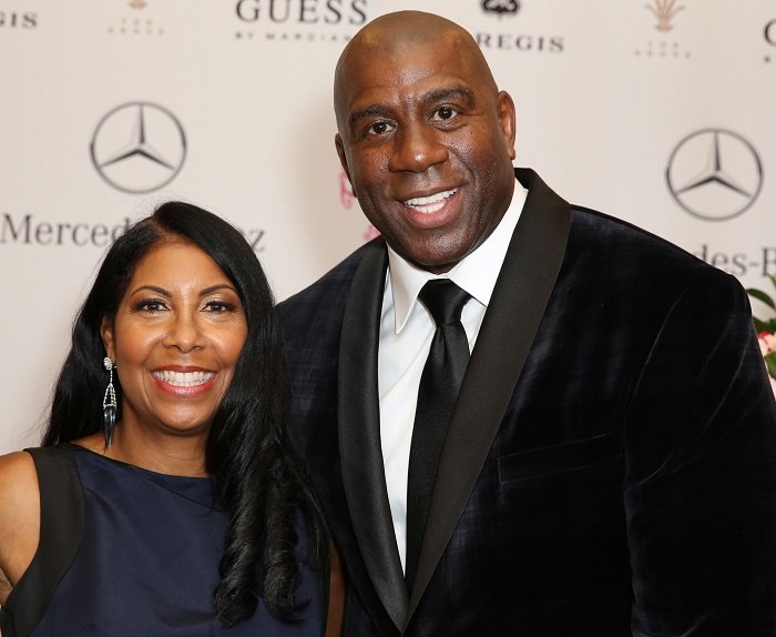 Magic Johnson and wife Cookie Johnson arrive at the 2014 Carousel of Hope Ball Presented By Mercedes-Benz at The Beverly Hilton Hotel on October 11, 2014. | Photo: Getty Images