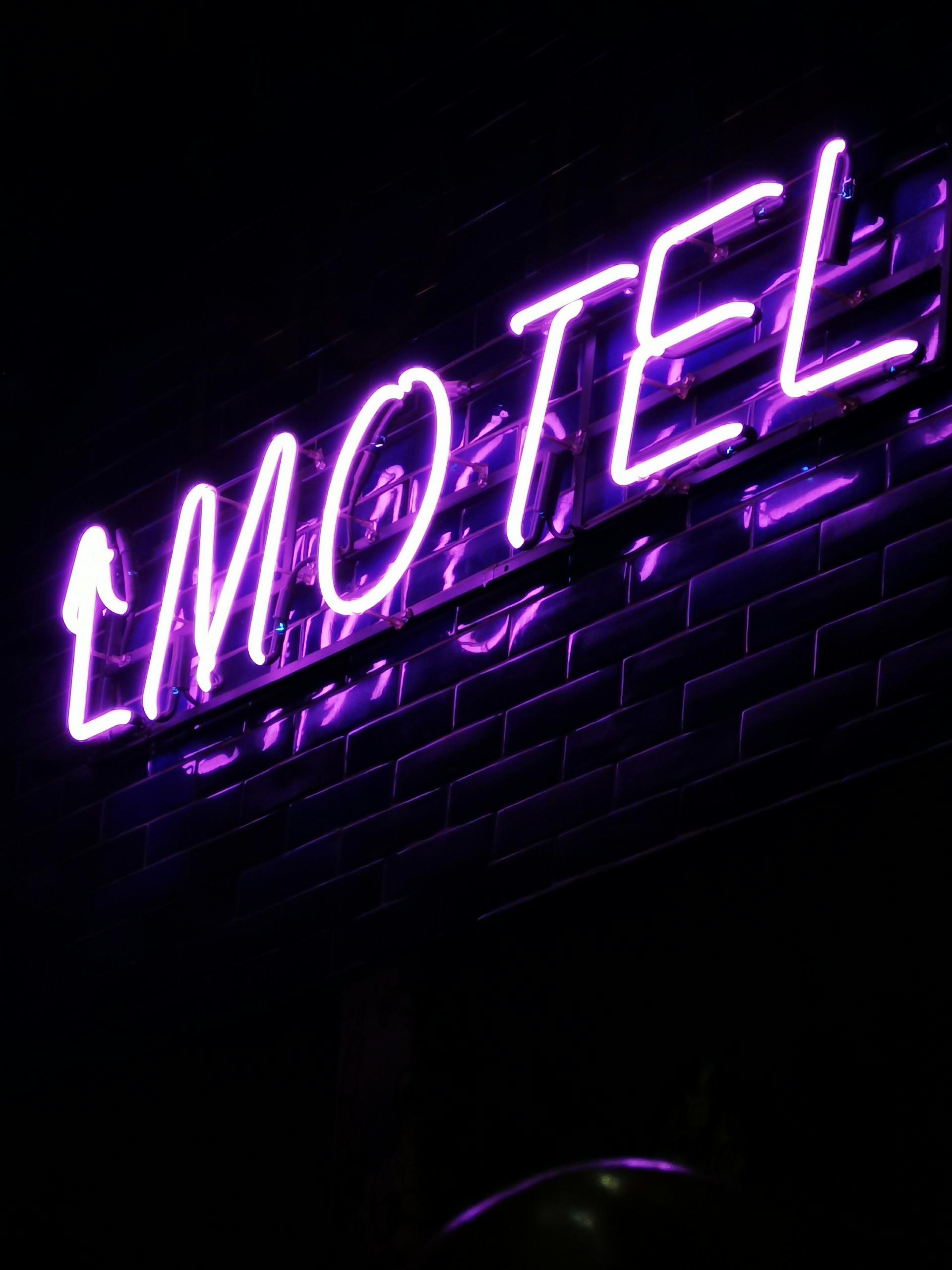 A neon sign of a motel | Source: Pexels