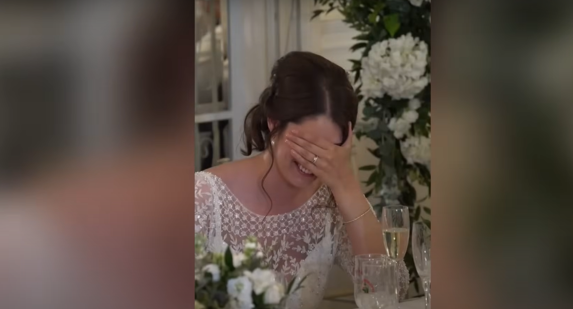 New bride Katie visibly embarrassed as she holds her head | Source: YouTube / Daily Record