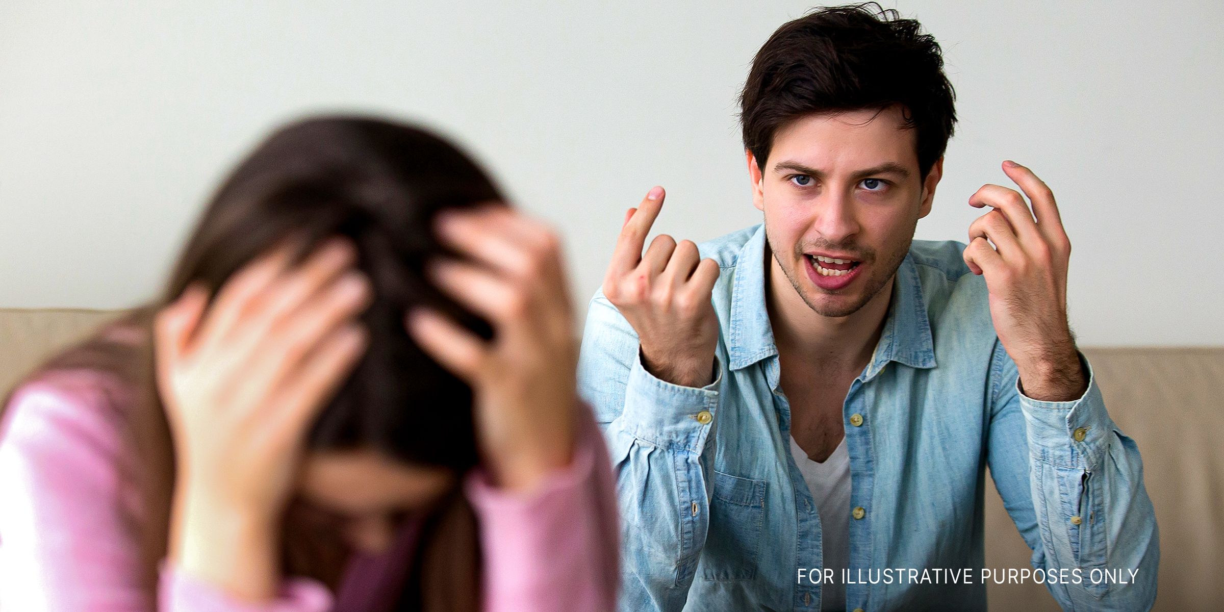 A man yelling at a woman as she buries her head in her hands | Source: Shutterstock