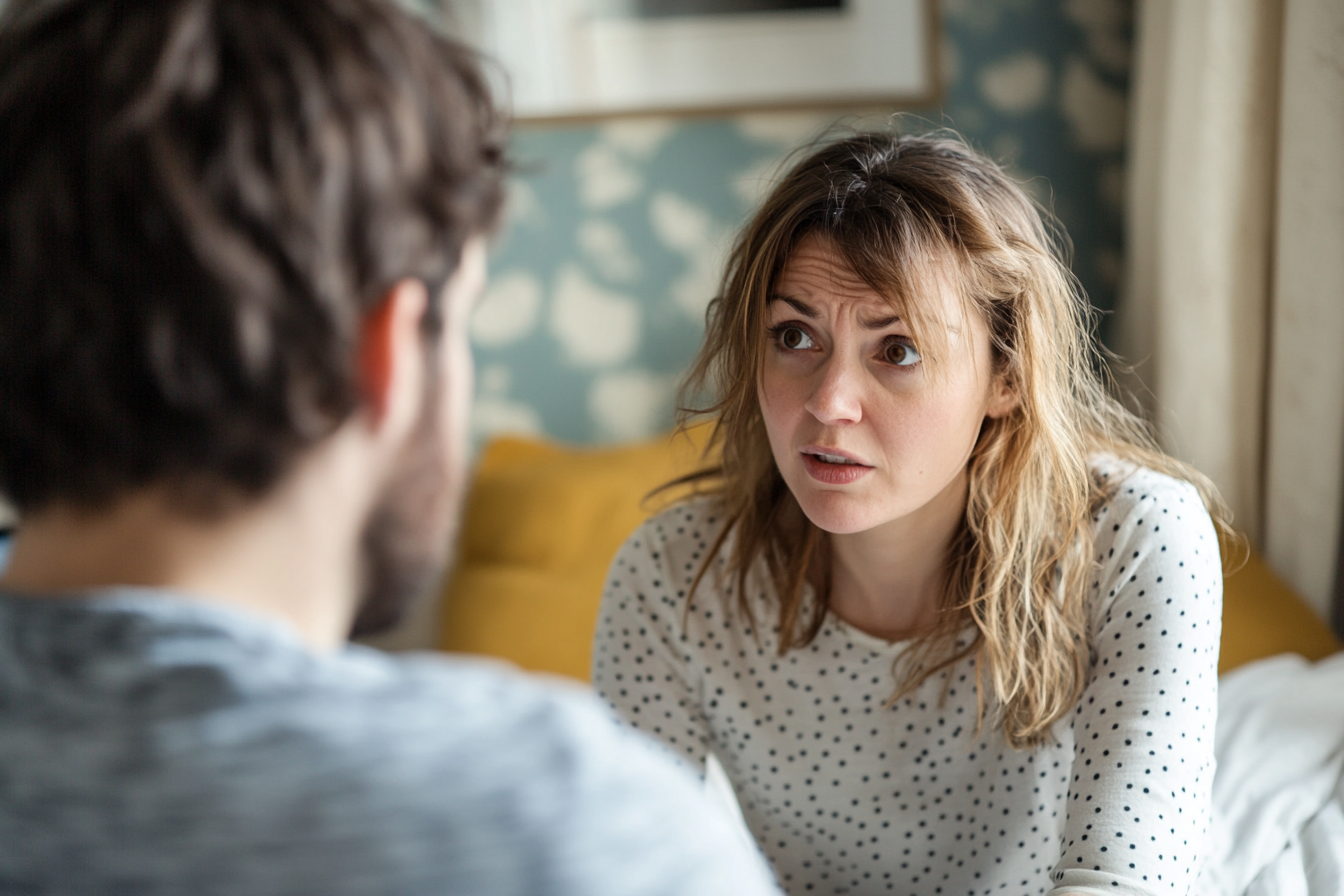 A woman speaking with her husband | Source: Midjourney