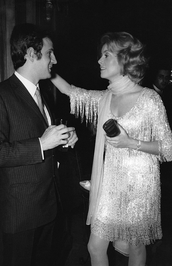 Catherine Deneuve et François Truffaut à une soirée. | Photo : Getty Images Catherine Deneuve et François Truffaut à une soirée. | Photo : Getty Images