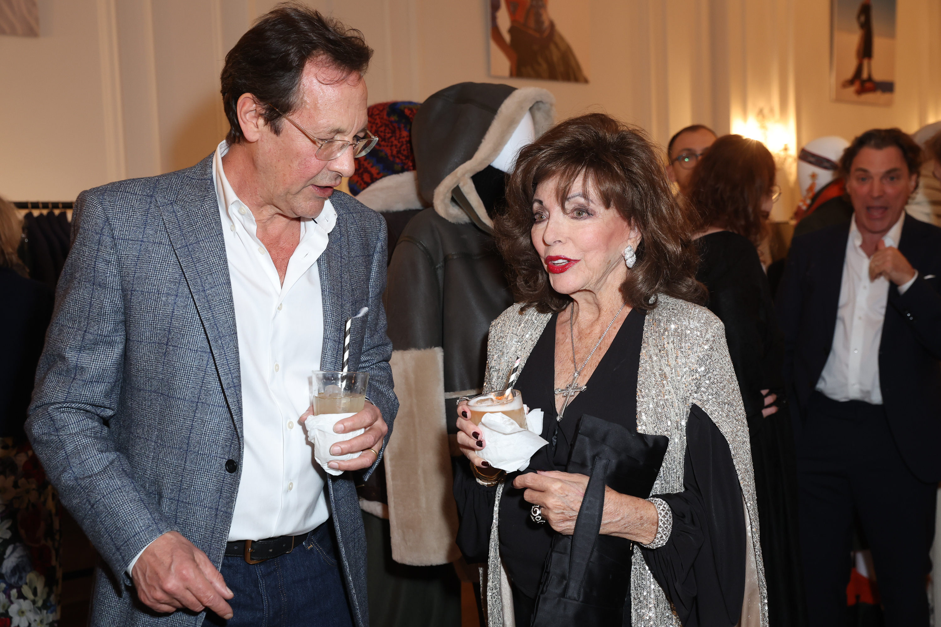 Percy Gibson and Dame Joan Collins at the Glenda Bailey x Peruvian Connection collaboration launch at The Polish Hearth Club on October 20, 2022 in London, England | Getty Images