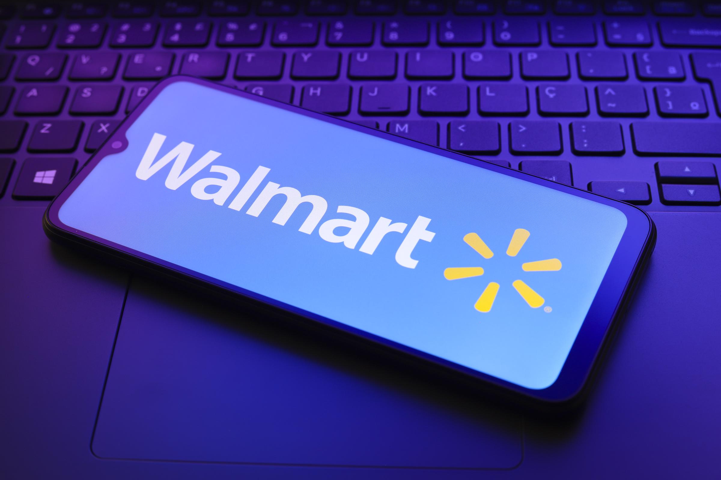 A photo of the Walmart wordmark and logo on a smart phone in Reno, US on December 20, 2024. | Source: Getty Images