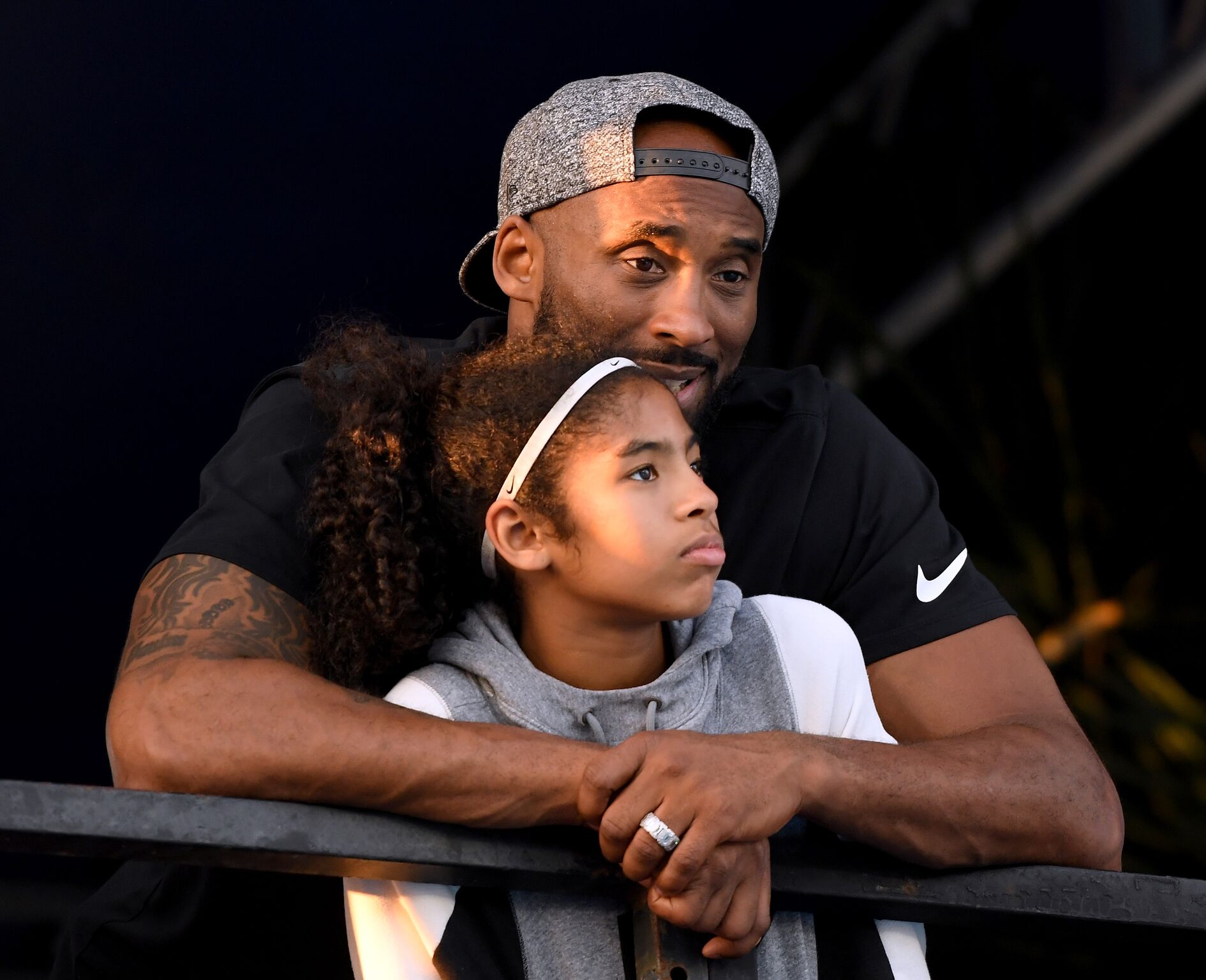 Kobe Bryant and daughter Gianna Bryant watch during day 2 of the Phillips 66 National Swimming Championships at the Woollett Aquatics Center on July 26, 2018 | Photo: Getty Images