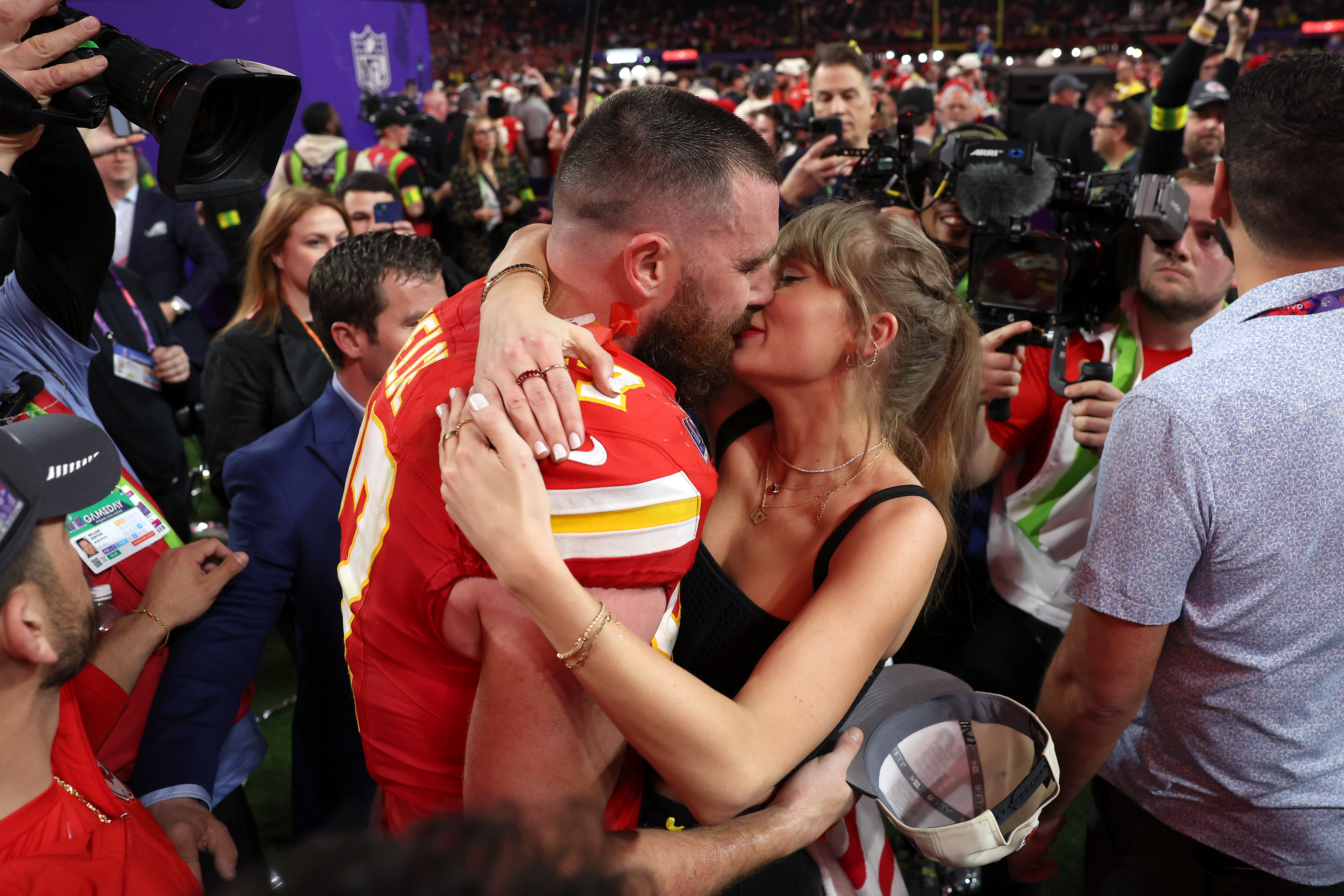 Travis Kelce kisses Taylor Swift during Super Bowl LVIII at Allegiant Stadium on February 11, 2024, in Las Vegas, Nevada. | Source: Getty Images