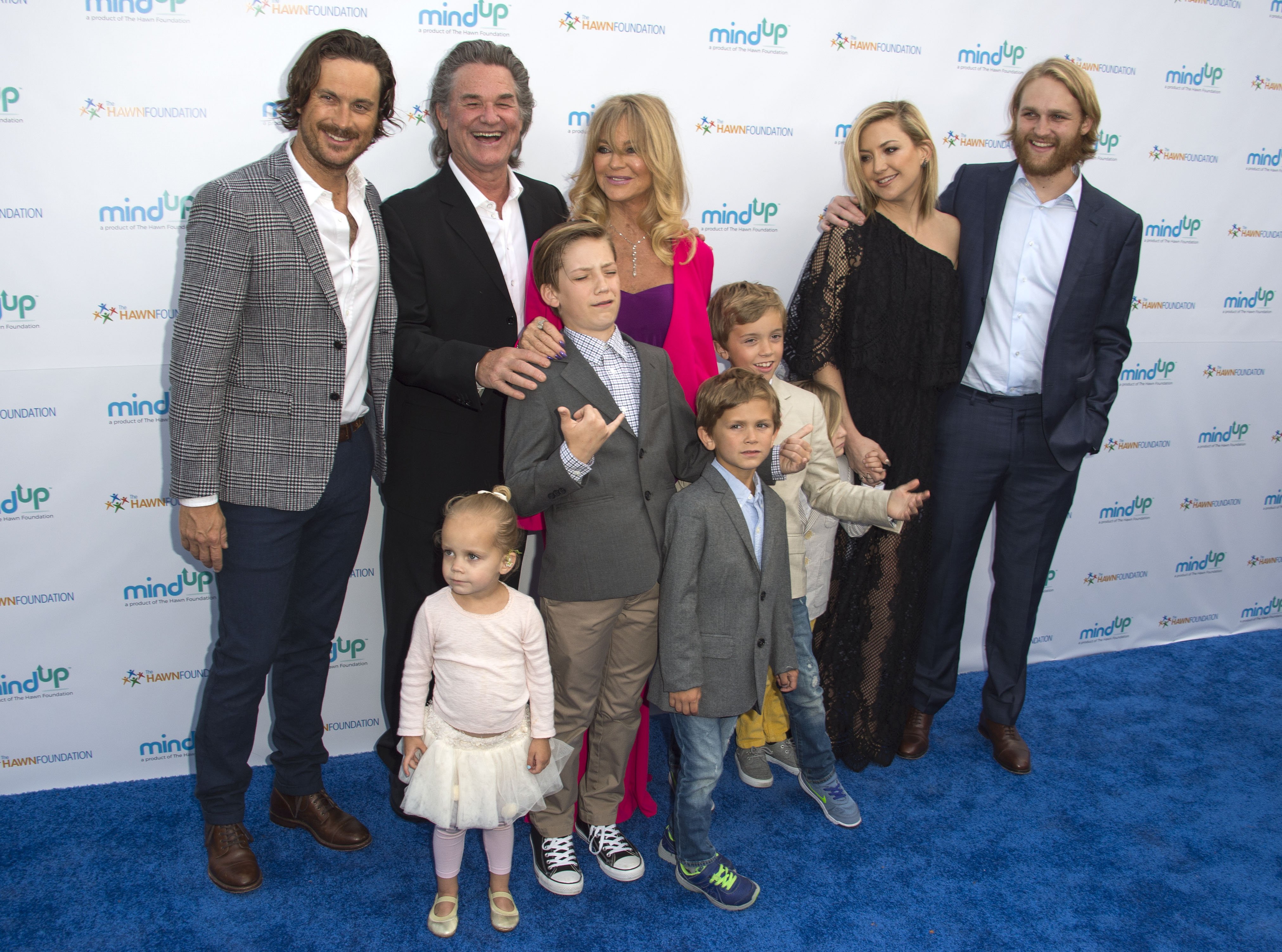 Oliver Hudson, Kurt Russell, Goldie Hawn, Wyatt Russell and Kate Hudson with kids Ryder Robinson, Wilder Hudson, Bodhi Hudson, Rio Hudson and Bingham Bellamy attend Goldie Hawn's Annual "Goldie's Love in for Kids" Event, in Beverly Hills, California, on May 6, 2016. | Source: Getty Images