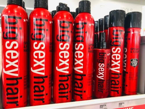 Hairspray for sale on a shelf. | Source: Shutterstock.