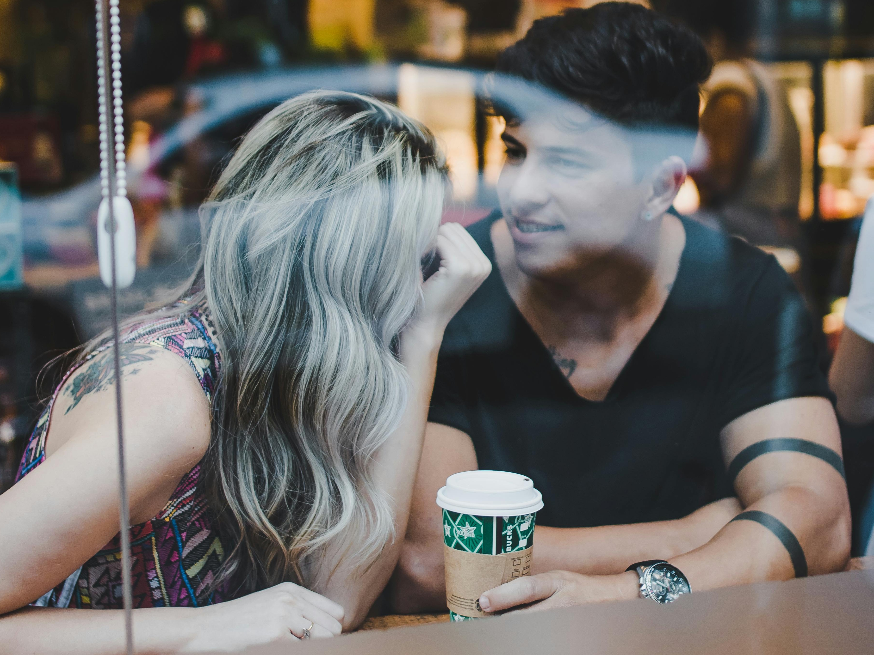 A man and woman conversation in a coffee shop | Source: Pexels