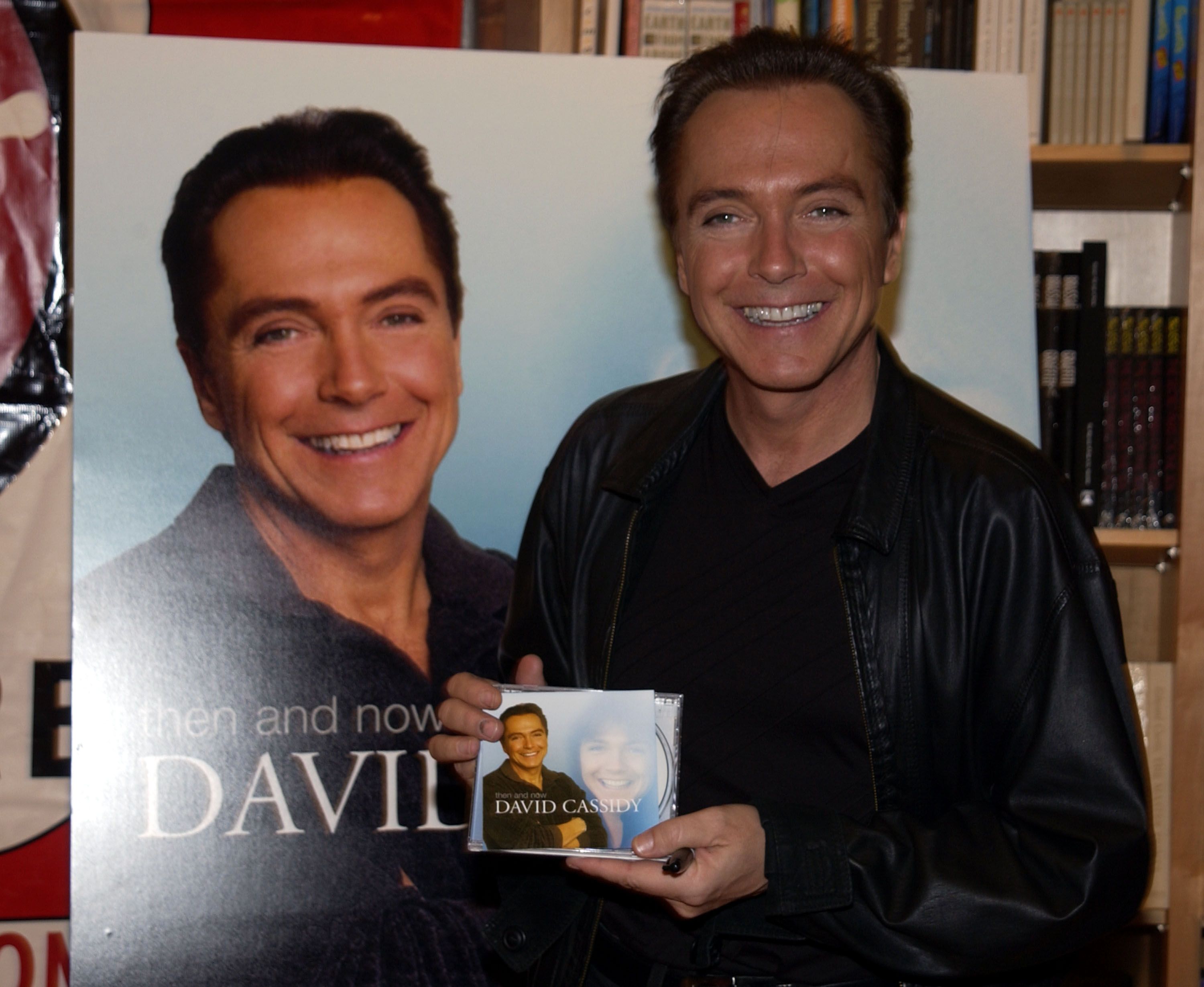 David Cassidy signs copies of his latest CD, "Then And Now" during an in-store appearance on May 15, 2002. | Source: Albert L. Ortega/WireImage/Getty Images