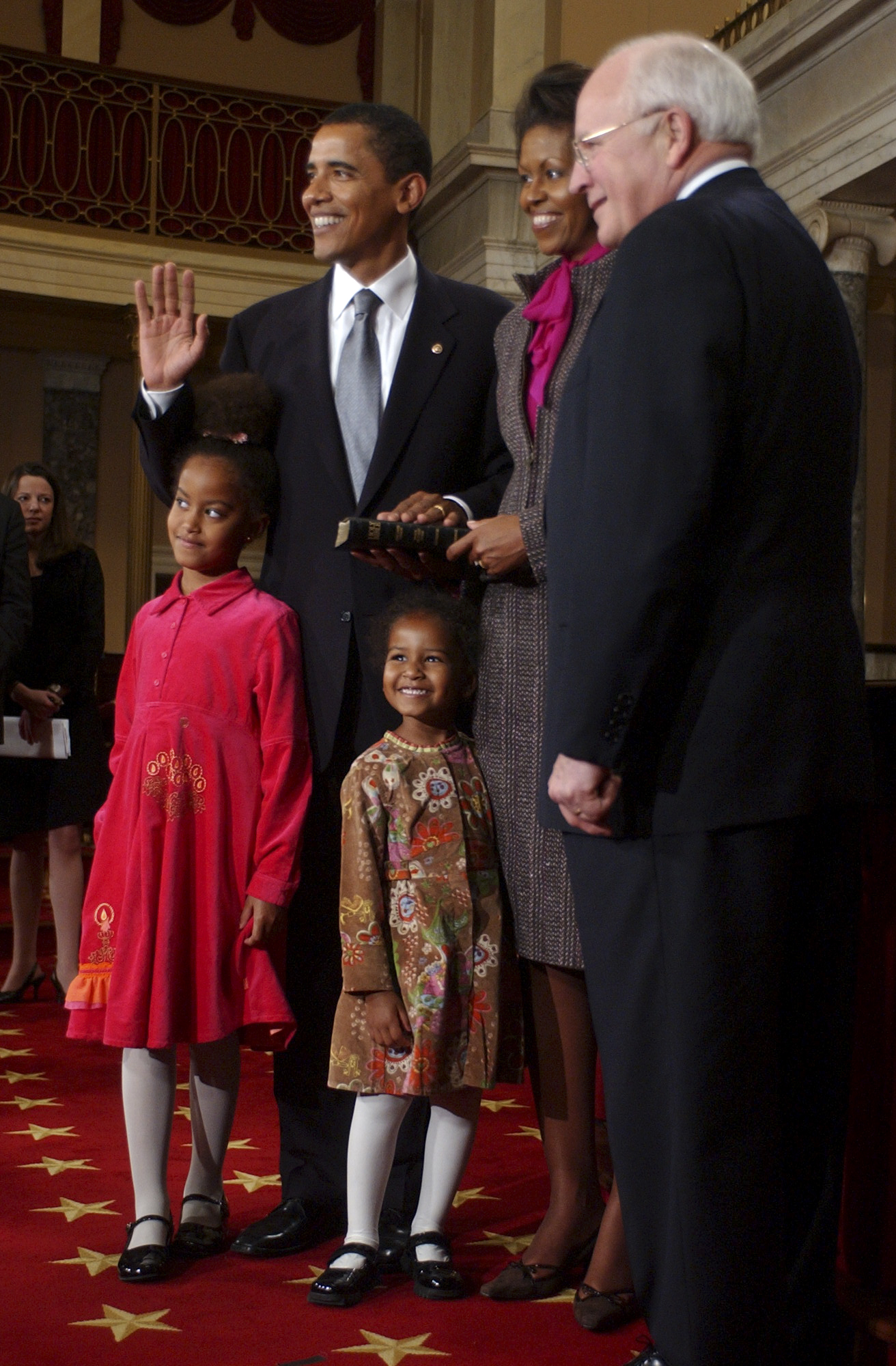 Barack Obama is sworn in as Michelle, Malia, and Sasha Obama and Dick Cheney look, in the US, on January 4, 2005. | Source: Getty Images