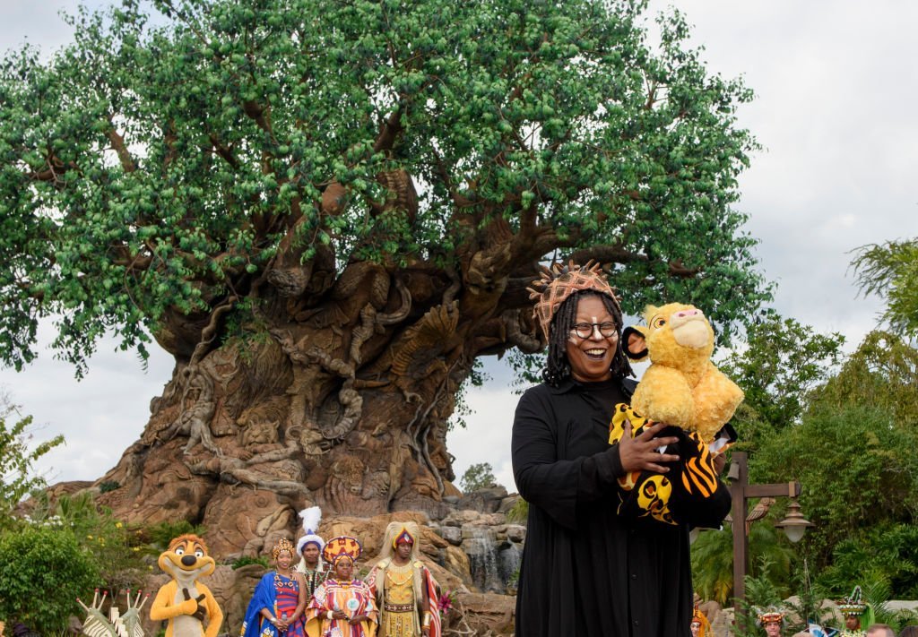 Whoopi Goldberg and the cast of the musical show "Festival of the Lion King" work on ABC's "The View" broadcasting from Disneys Animal Kingdom in Lake Buena Vista, Florida | Photo: Getty Images