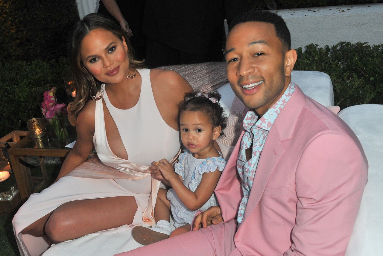 Chrissy Teigen, Luna Simone Stephens and John Legend attend John Legend's launch of his new rose wine brand. | Source: Getty Images