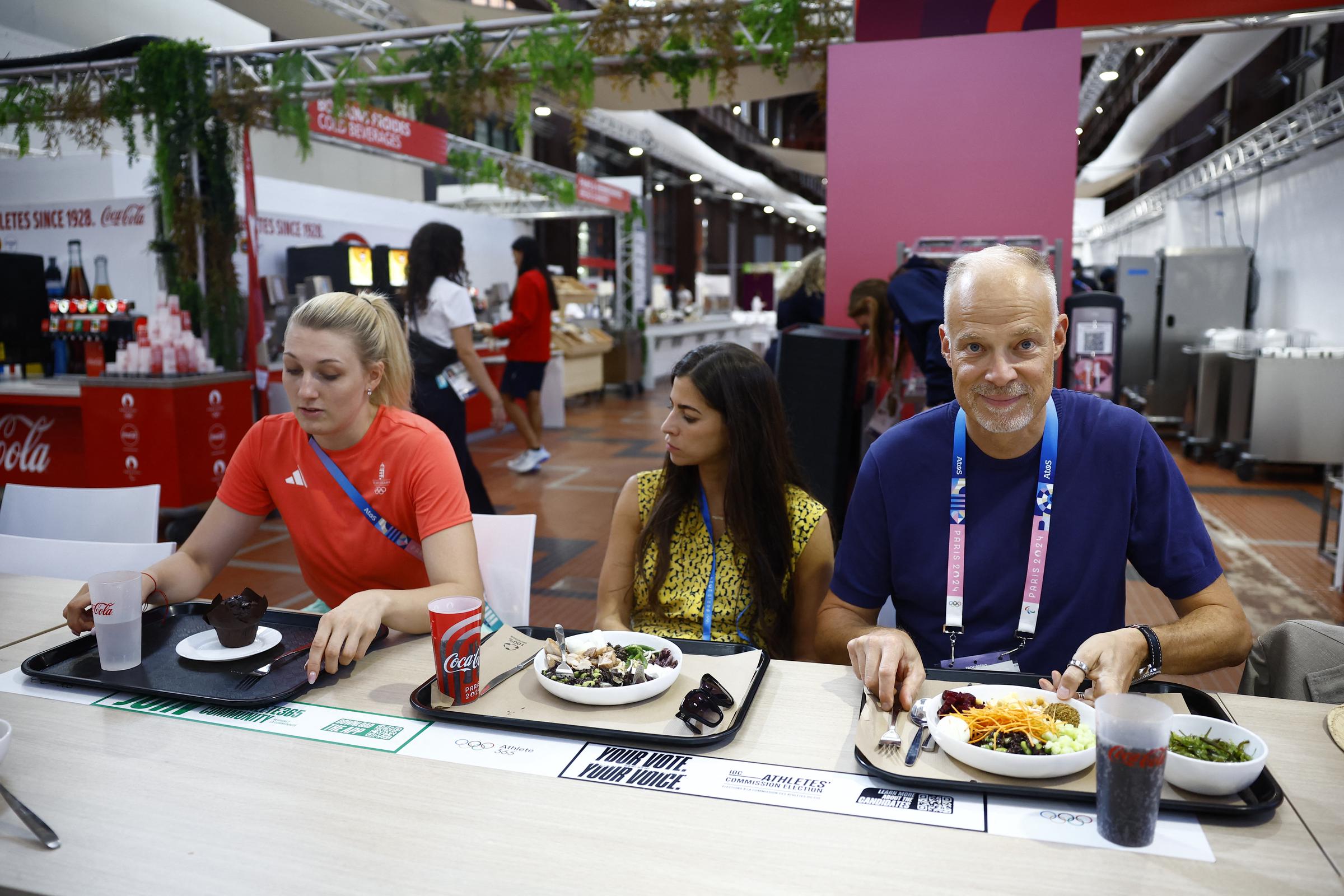 Hungary's Minister of Defense and Sport Kristof Szalay-Bobrovniczky having a meal with Fencing Bronze medalist Eszter Muhari at the Olympic Village during the Olympic Games Paris 2024 on July 28 in France. | Source: Getty Images