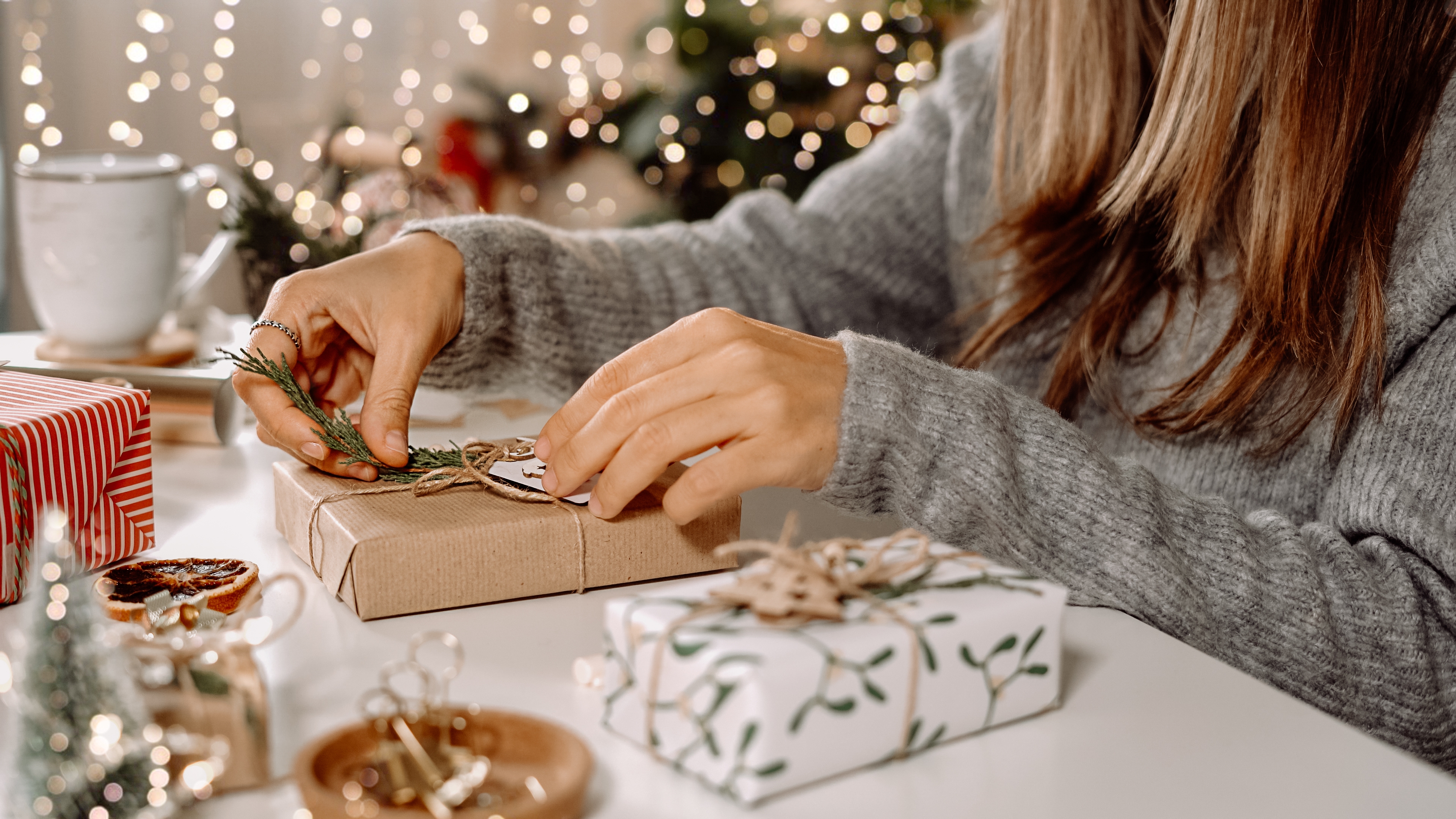 A woman wrapping gifts | Source: Shutterstock
