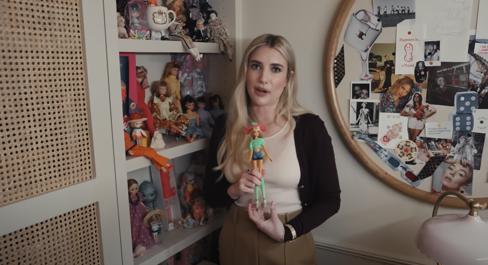 Emma Roberts and her doll wall featured in Architectural Digest, dated April 2024 | Source: YouTube/Architectural Digest