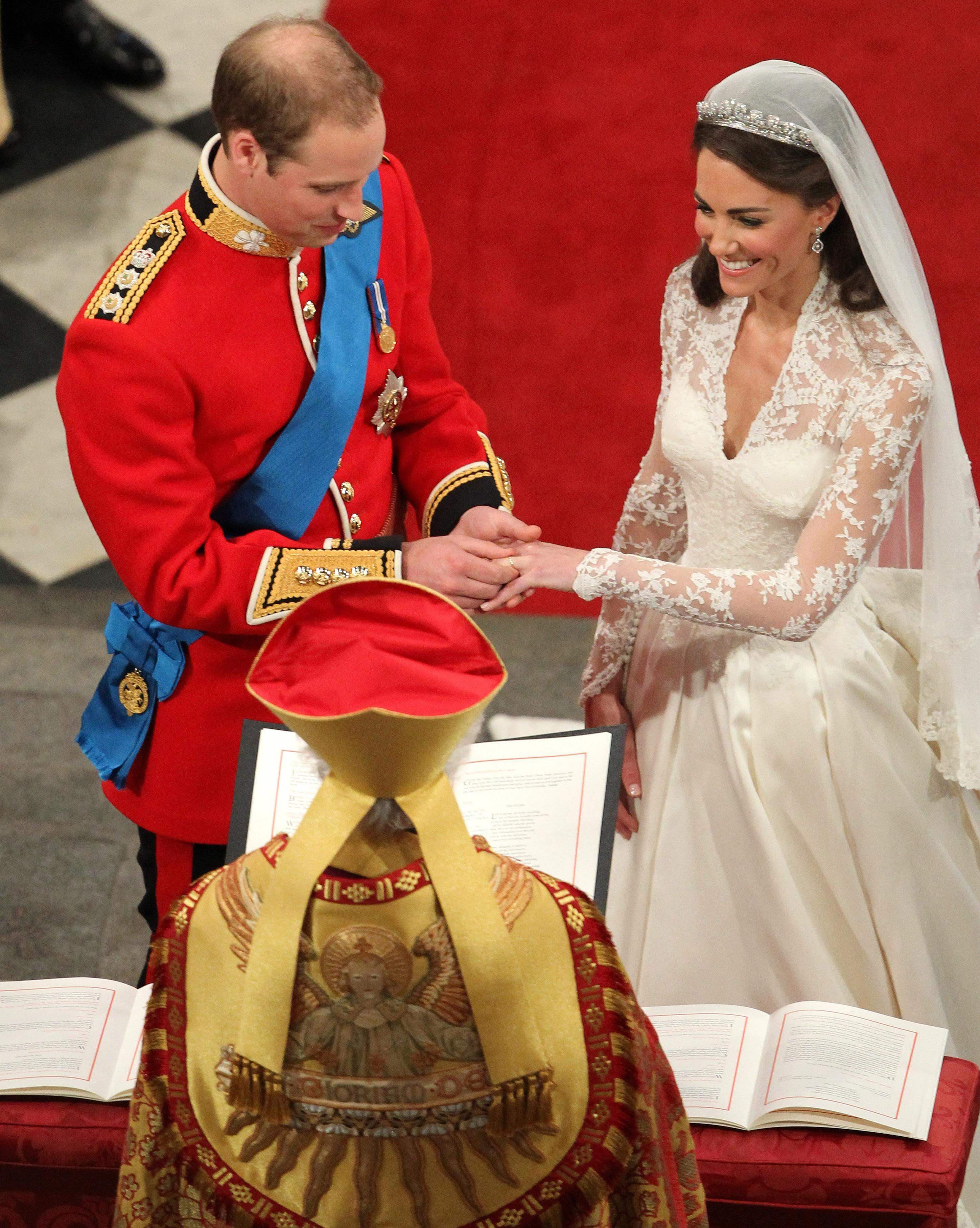 Prince William gives Catherine Middleton her wedding band during their wedding service at Westminster Abbey, in London, England, on April 29, 2011 | Source: Getty Images