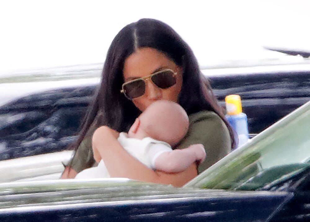 Meghan Markle gives baby Archie a kiss. | Source: Getty Images