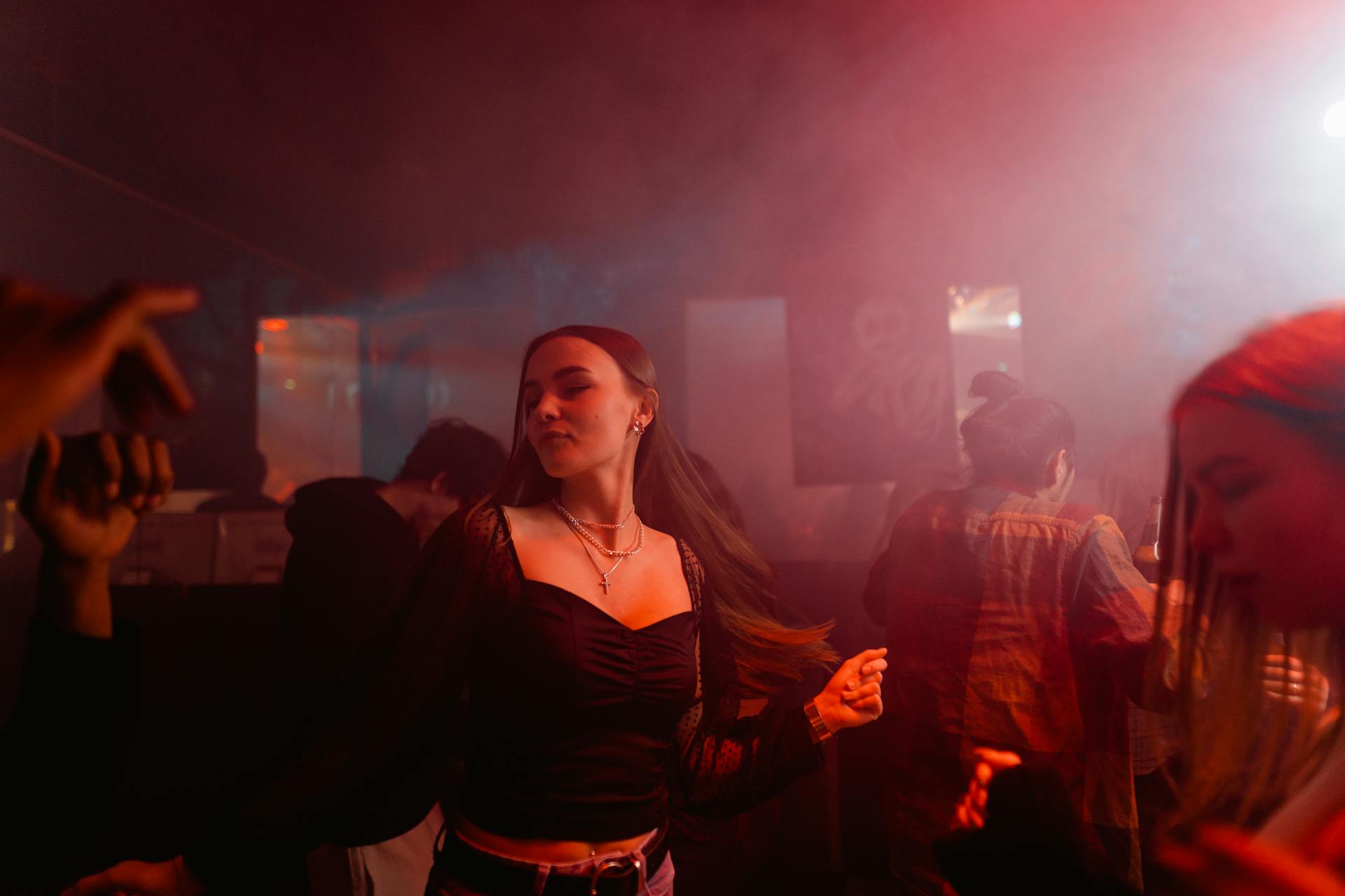 A woman dancing in a club | Source: Pexels