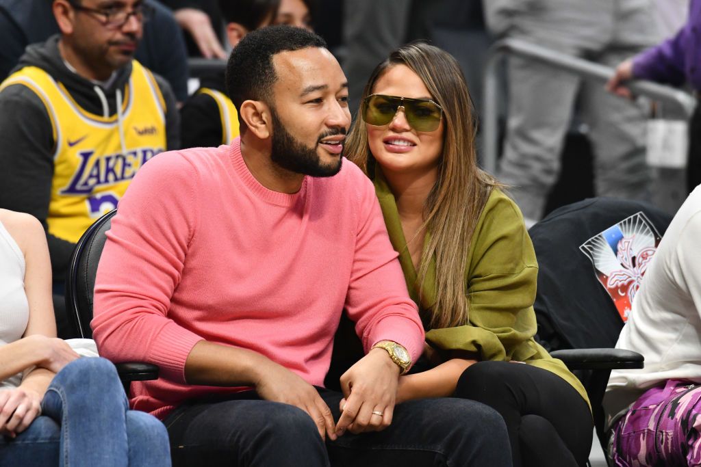 John Legend and Chrissy Teigen at a basketball game between the Los Angeles Clippers and the Los Angeles Lakers on March 08, 2020 | Getty Images