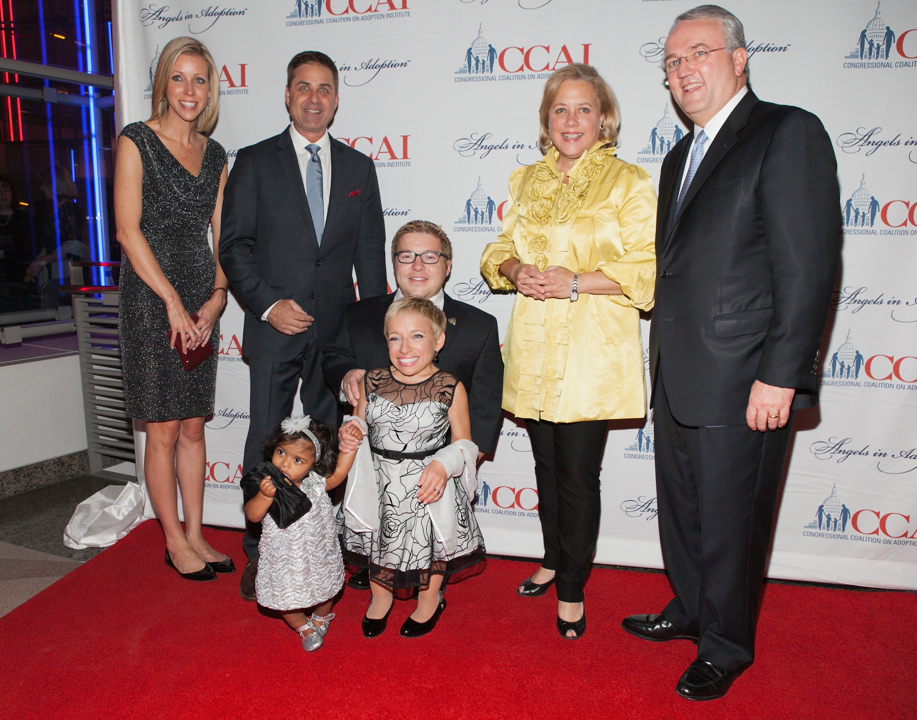 Becky Weichhand, Mark Walberg, Bill Klein, Jen Arnold with daughter Zoey, Sen. Mary Landrieu, and Jack Gerard attend the 2014 Angels In Adoption Gala in Washington, DC on September 17, 2014 | Photo: Getty Images