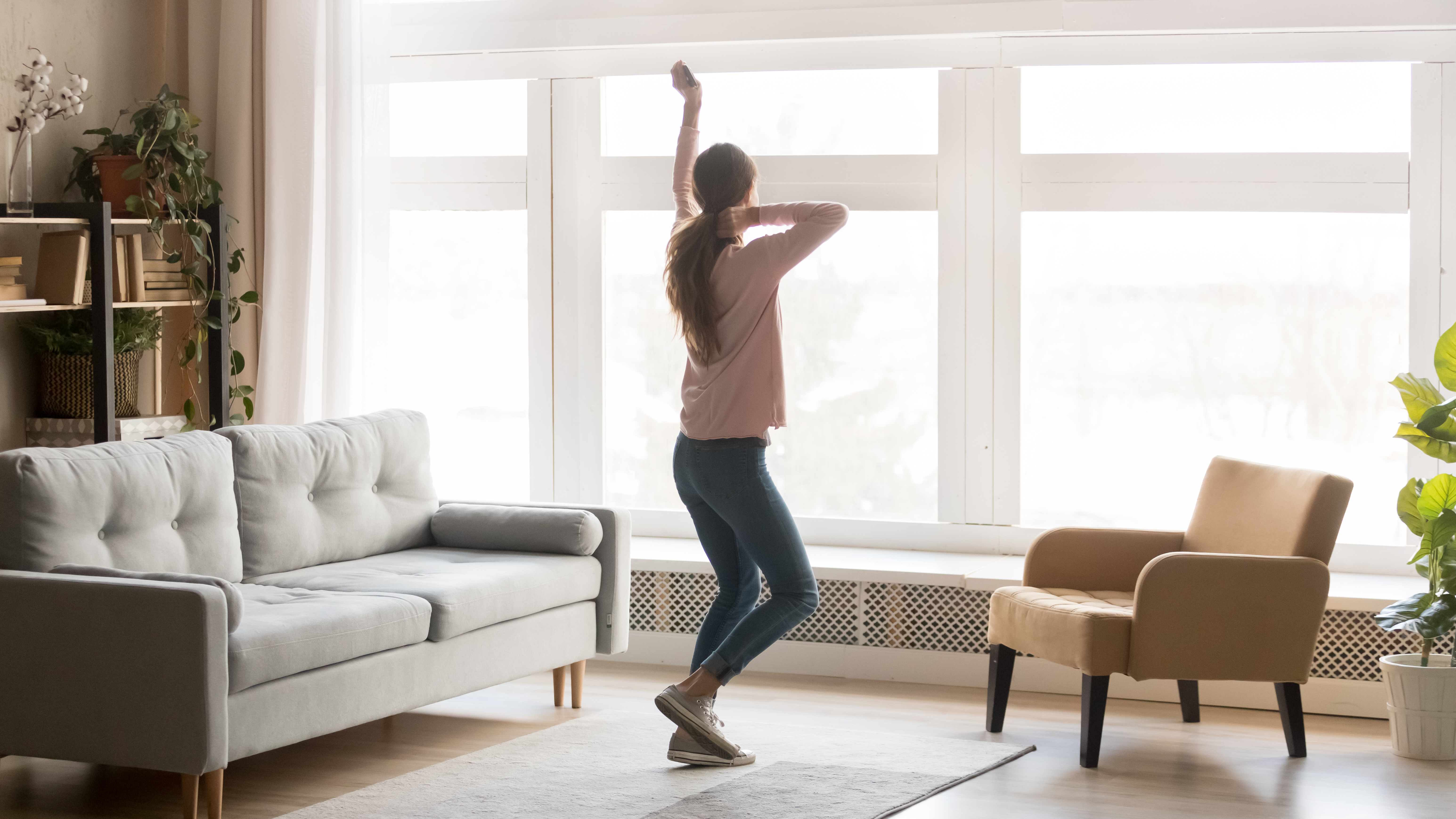 A woman dancing in a new home  | Source: Shutterstock