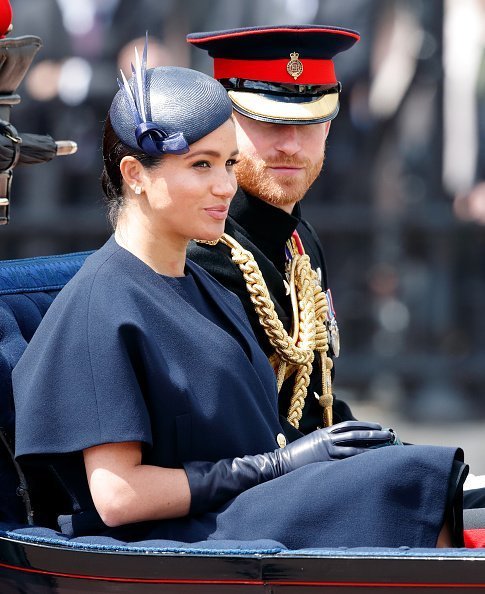 Meghan and Prince Harry travel down The Mall in a horse drawn carriage during Trooping The Colour, the Queen's annual birthday parade | Photo: Getty Images