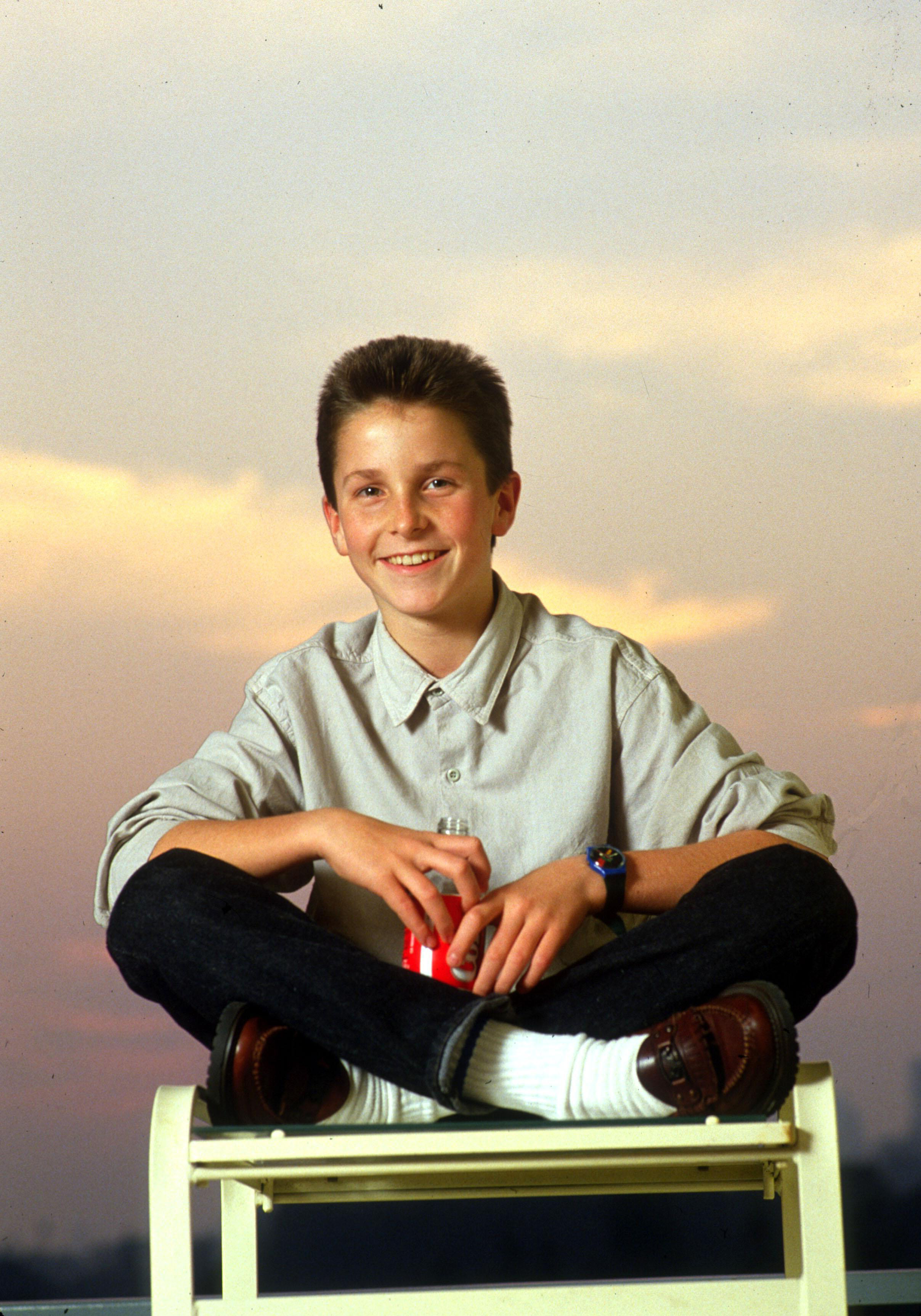 Christian Bale poses during a publicity tour for "Empire of the Sun" in Beverly Hills, California on November 26, 1987 | Source: Getty Images
