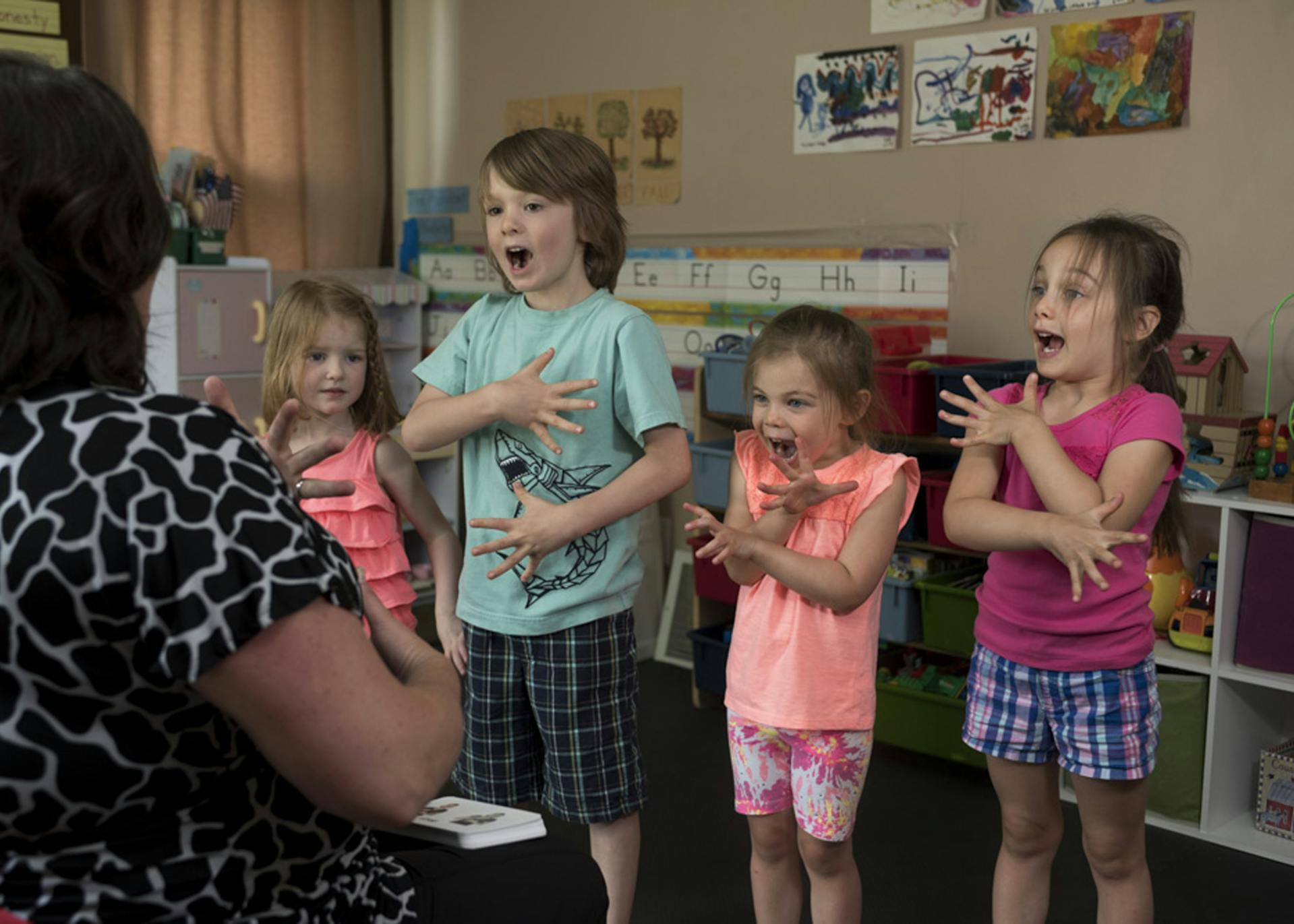 Children performing in front of their teacher | Source: Pexels