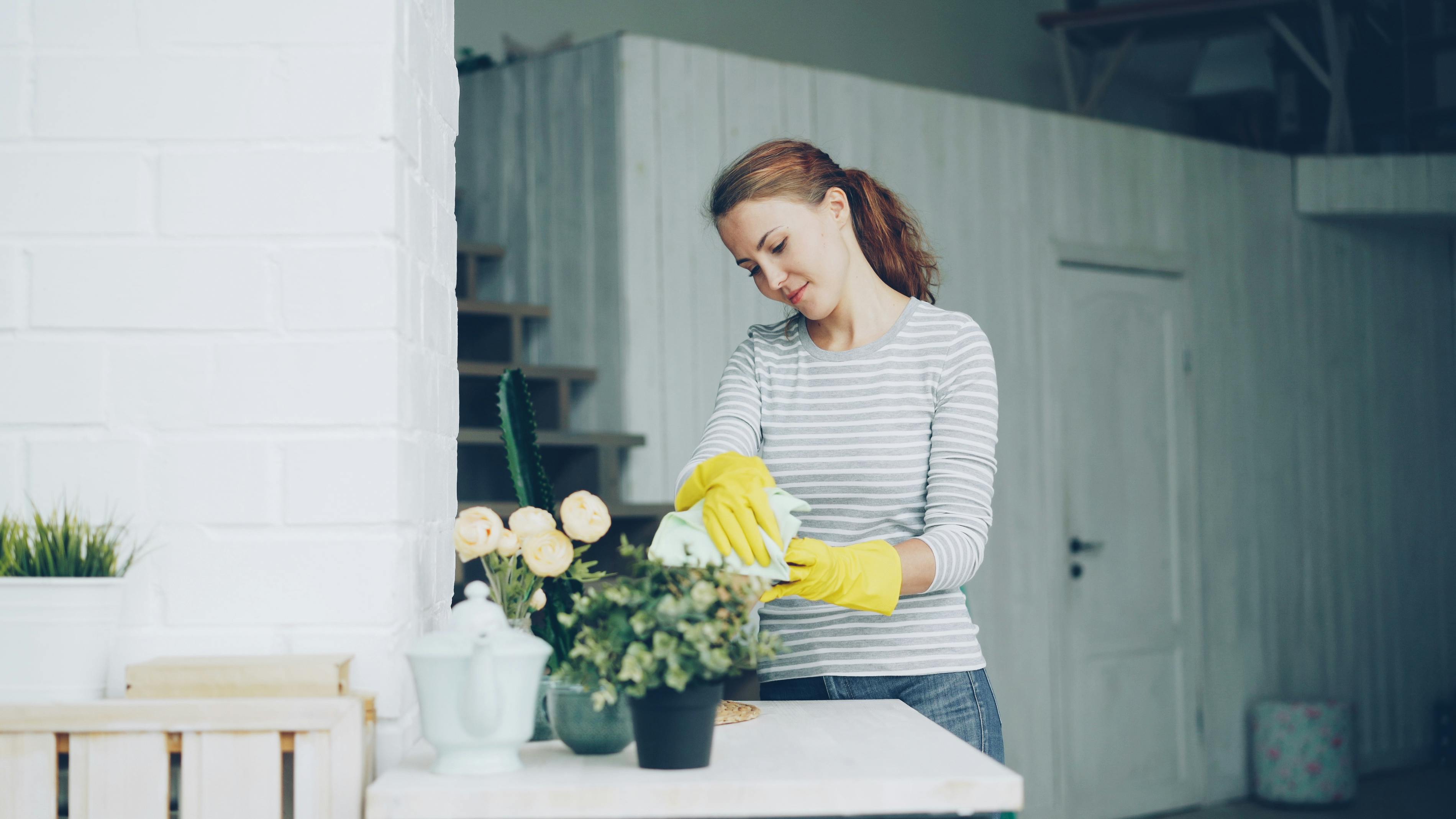 A woman tending to her plants | Source: Pexels