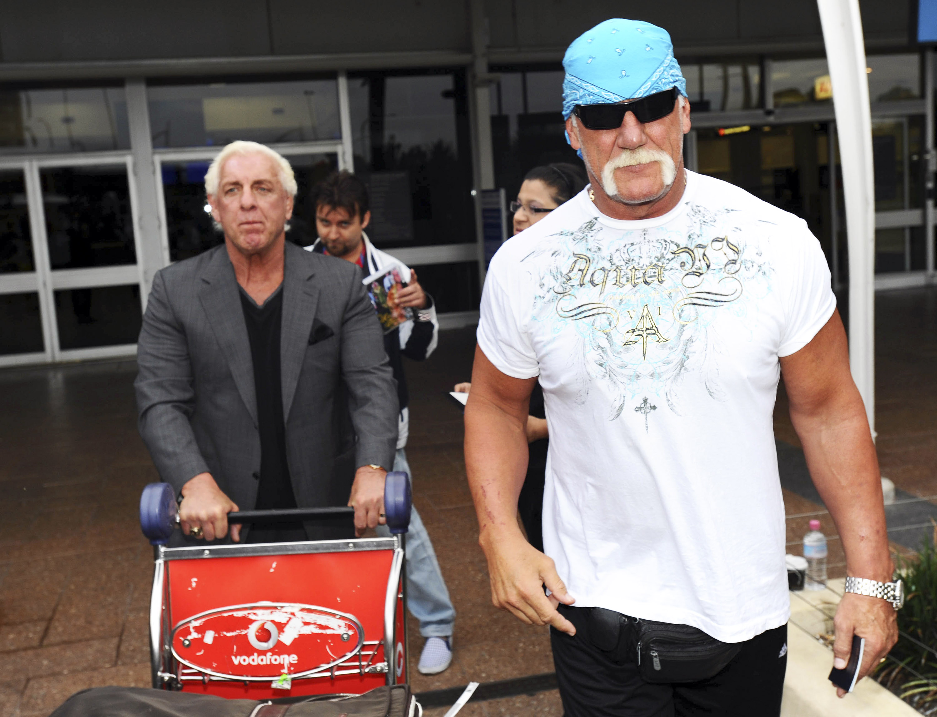 Ric Flair and Hulk Hogan arrive at Sydney Airport ahead of the 'Hulkmania' tour on November 17, 2009 in Sydney, Australia. | Source: Getty Images