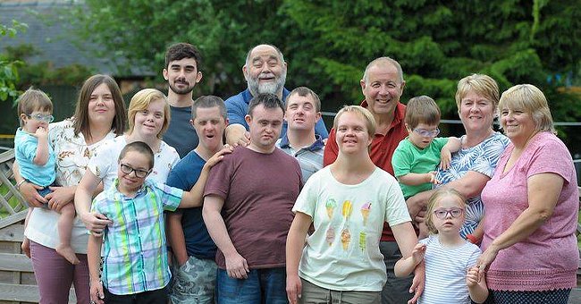  Pam Patterson and her husband, Gerald Patterson with their adopted children, James, Alice, Molly, and Riley.  Roger Bull, and his wife with their adopted children, David and Timothy.  Roger's daughter Jenny Bull and her adopted children, Isabel and twins George and Tomas in a group family photo. | Source: facebook.com/autismdisabled