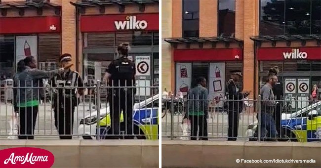 Traffic warden gives police car a ticket while officers help man inside shopping center