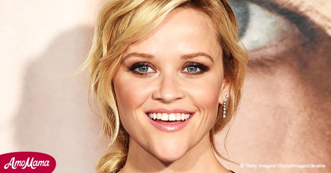 Reese Witherspoon appears on set in bright pink 80's outfit