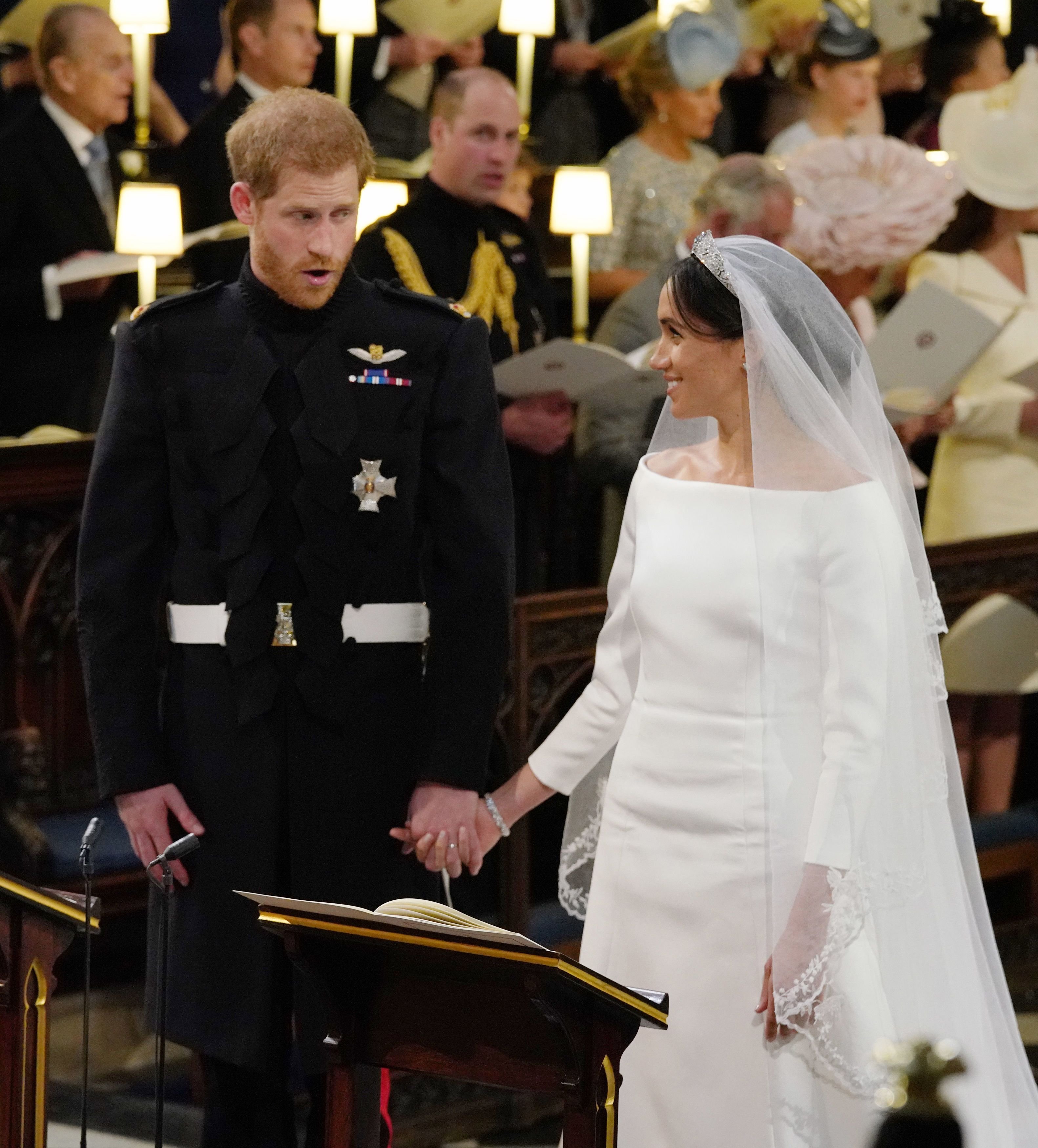 Prince Harry with Meghan Markle during their wedding in St George's Chapel at Windsor Castle on May 19, 2018, in Windsor, England. | Source: Jonathan Brady - WPA Pool/Getty Images