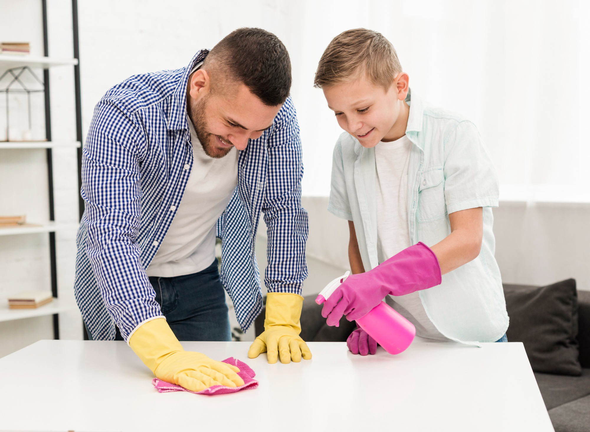 A man and a boy happily cleaning together | Source: Flickr