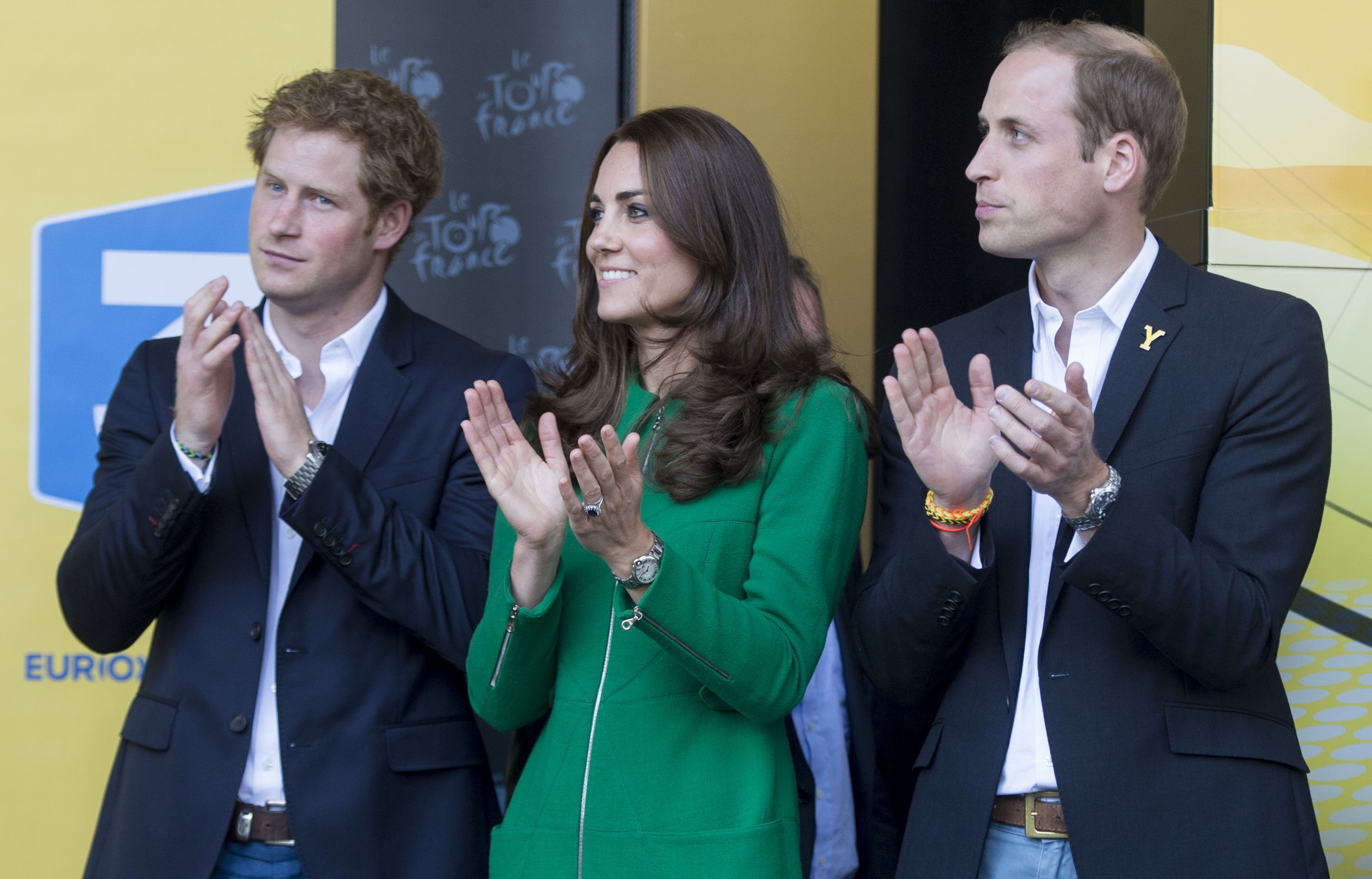     Prince William, Duke of Cambridge and Catherine, Duchess of Cambridge with Prince Harry at the finish line of the first stage of the Tour de France on July 5, 2014 in Harrogate, England.  |  Source: Getty Images