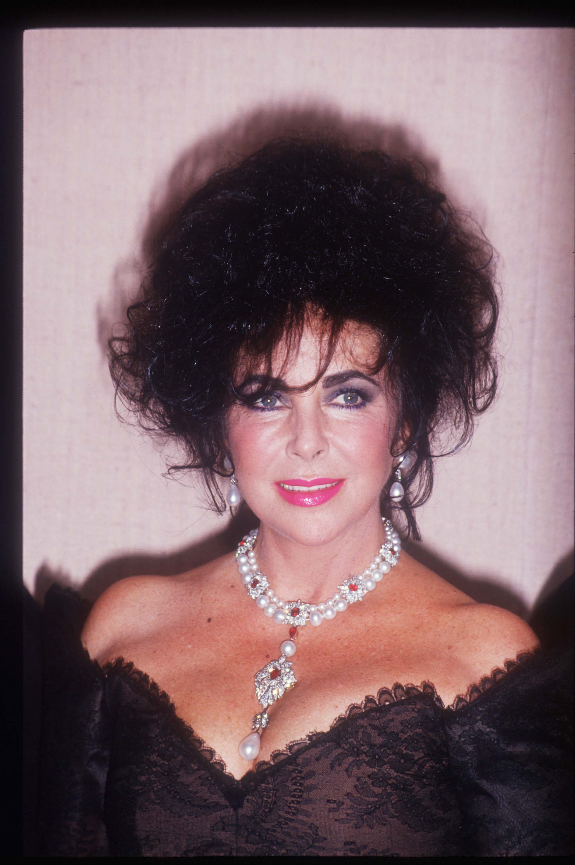  Actress Elizabeth Taylor stands January 19, 1992 in Los Angeles, CA. Taylor became a child star after her appearance in "National Velvet" and later won Academy Awards for her performances in "Butterfield 8" and " Who's Afraid of Virginia Woolf?" | Source: Getty Images