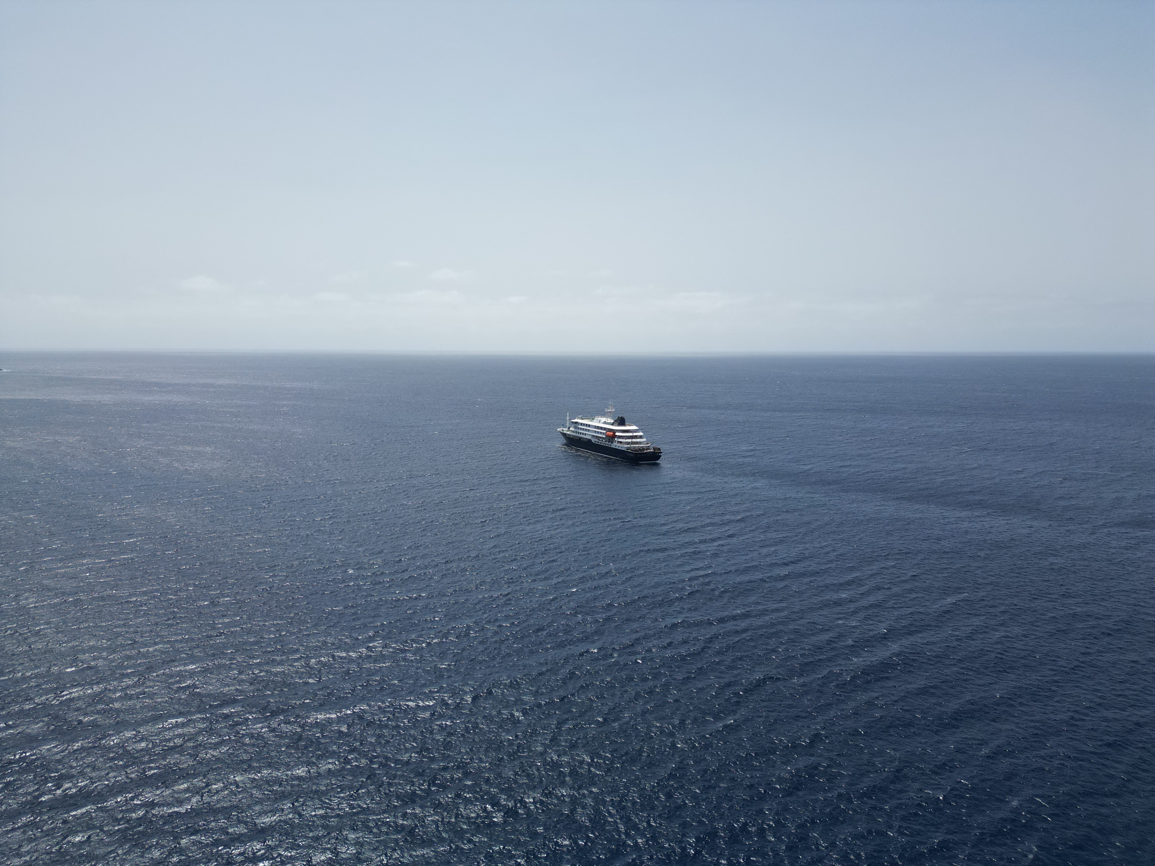This aerial picture shows a general view of the cruise ship MV Hondius stationary off the port of Praia, the capital of Cape Verde, on May 4, 2026 | Source: Getty Images
