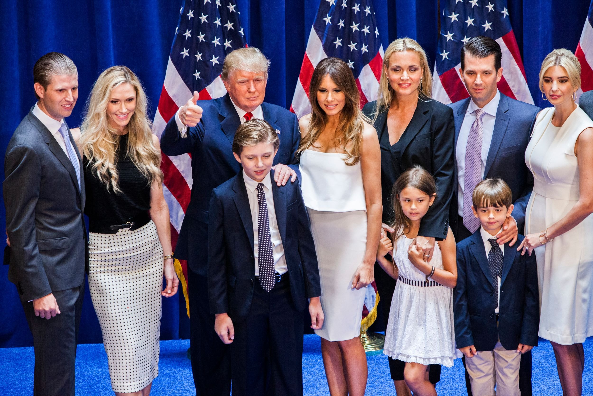 Eric Trump, Lara Yunaska Trump, Donald Trump, Barron Trump, Melania Trump, Vanessa Haydon Trump, Kai Madison Trump, Donald Trump Jr., Donald John Trump III, and Ivanka Trump pose for photos on stage after Donald Trump announced his candidacy for the U.S. presidency at Trump Tower 2015| Photo: Getty Images