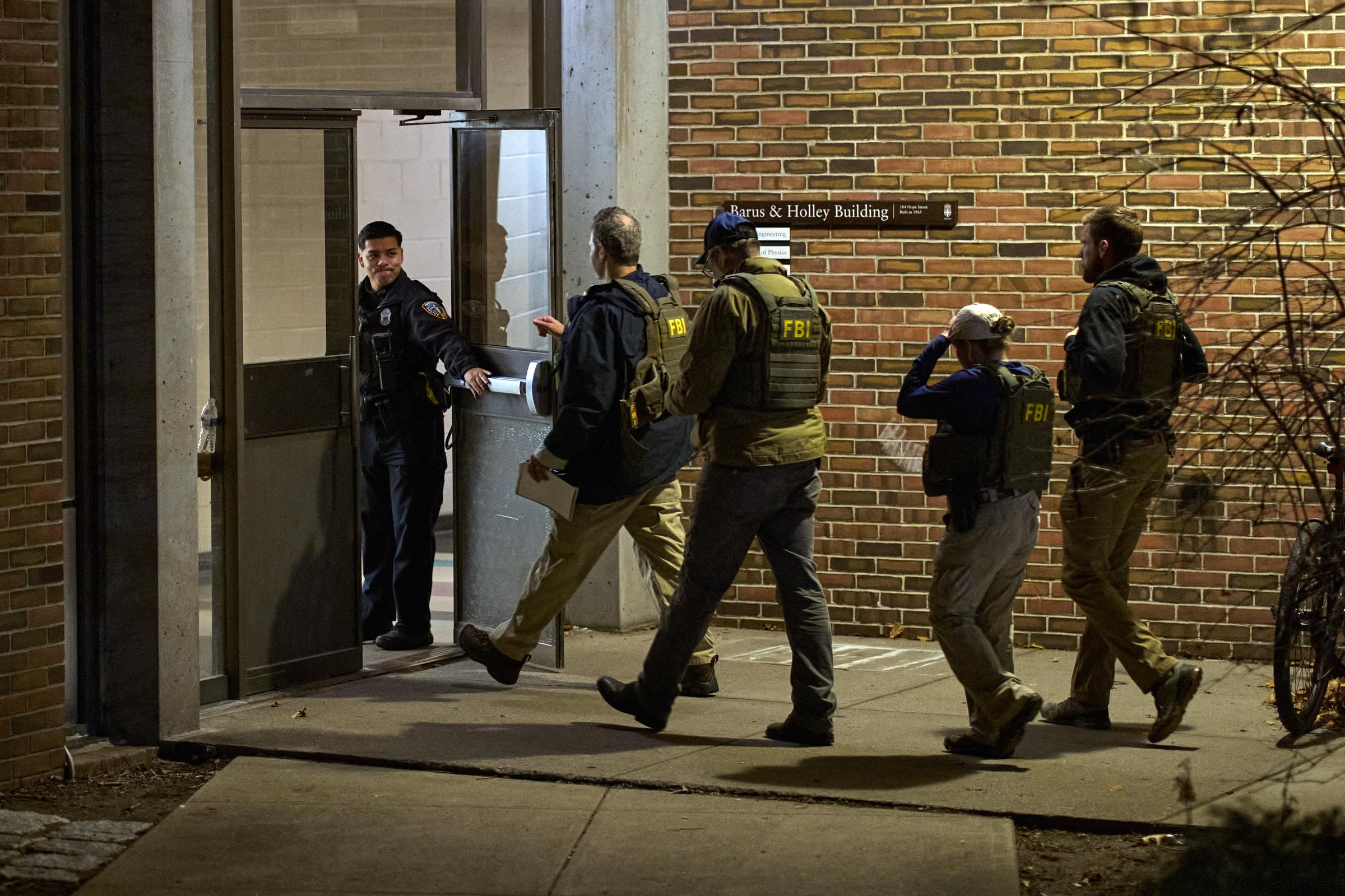 FBI agents enter the Barus & Holley building, the site of a mass shooting, at Brown University campus on December 13, 2025, in Providence, Rhode Island | Source: Getty Images