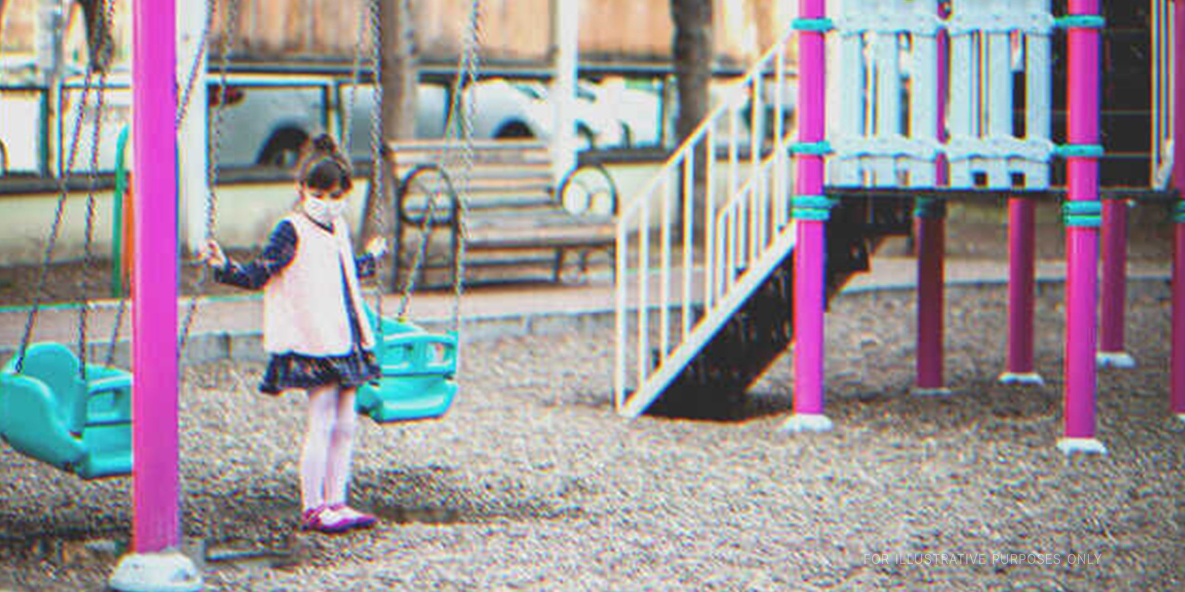 Little Girl By The Swing In a Playground | Source: Getty Images