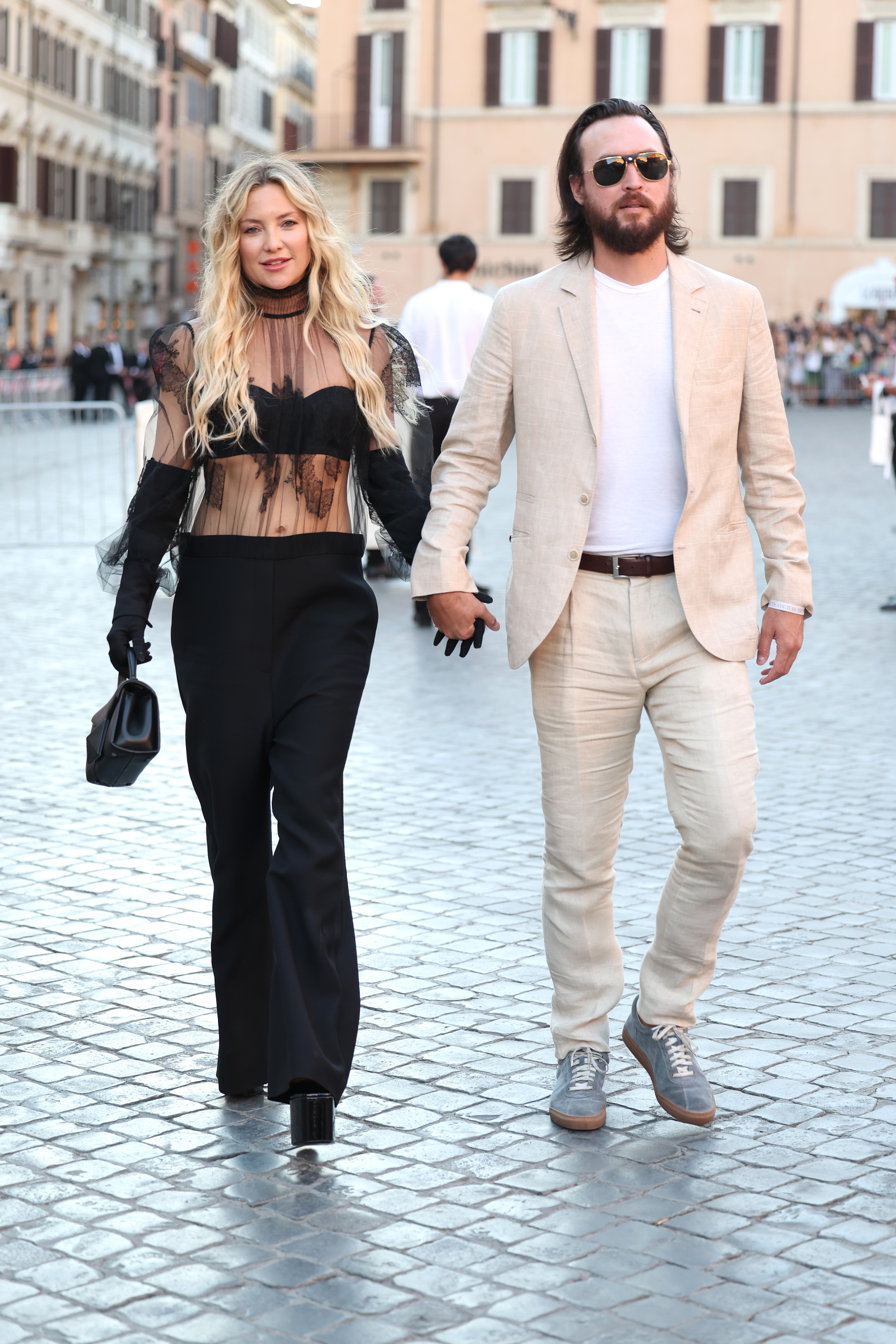 Kate Hudson and Danny Fujikawa at the Valentino Haute Couture Fall/Winter 22/23 fashion show on July 8, 2022, in Rome, Italy. | Source: Getty Images