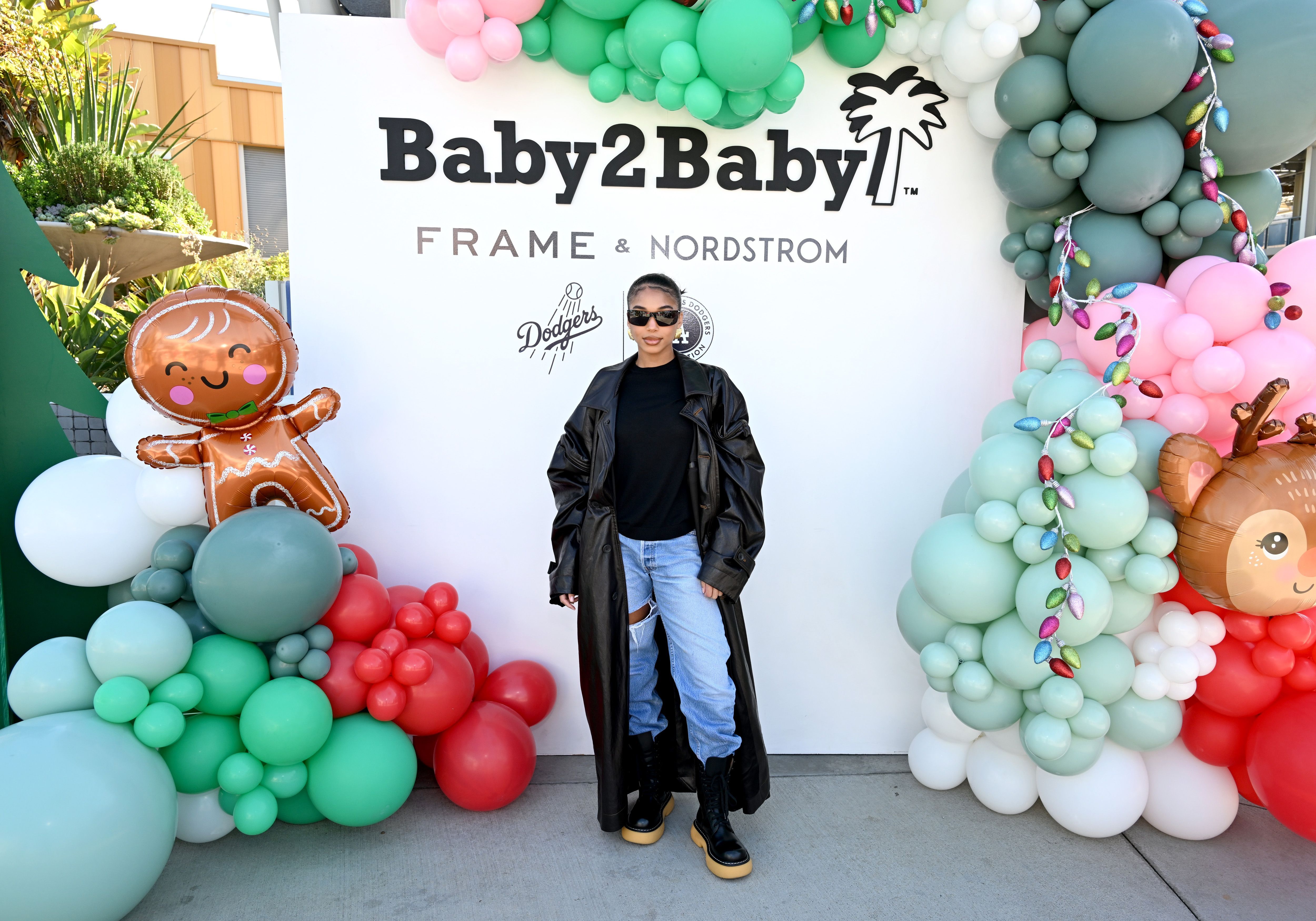 Lori Harvey at the 2023 Baby2Baby Holiday Distribution presented by FRAME & Nordstrom event in Los Angeles, California on December 13, 2023 | Source: Getty Images